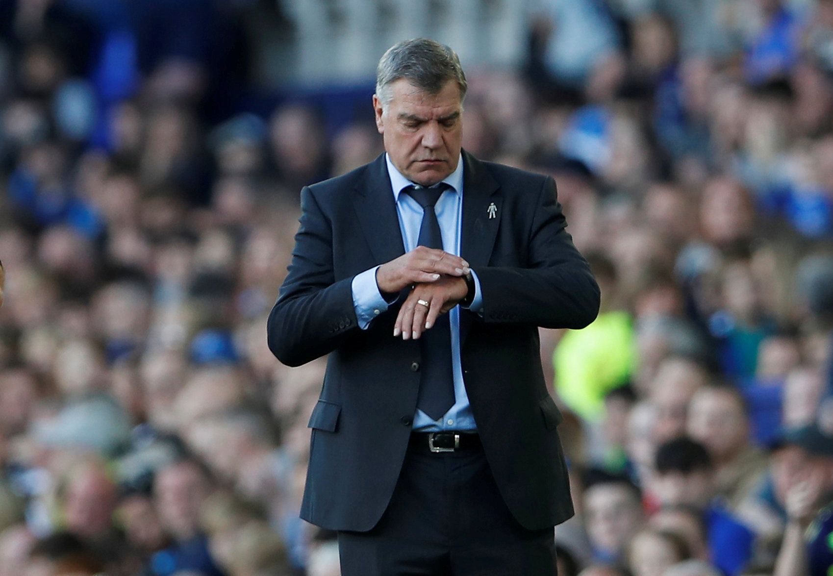 Sam Allardyce stands on the touch line. 