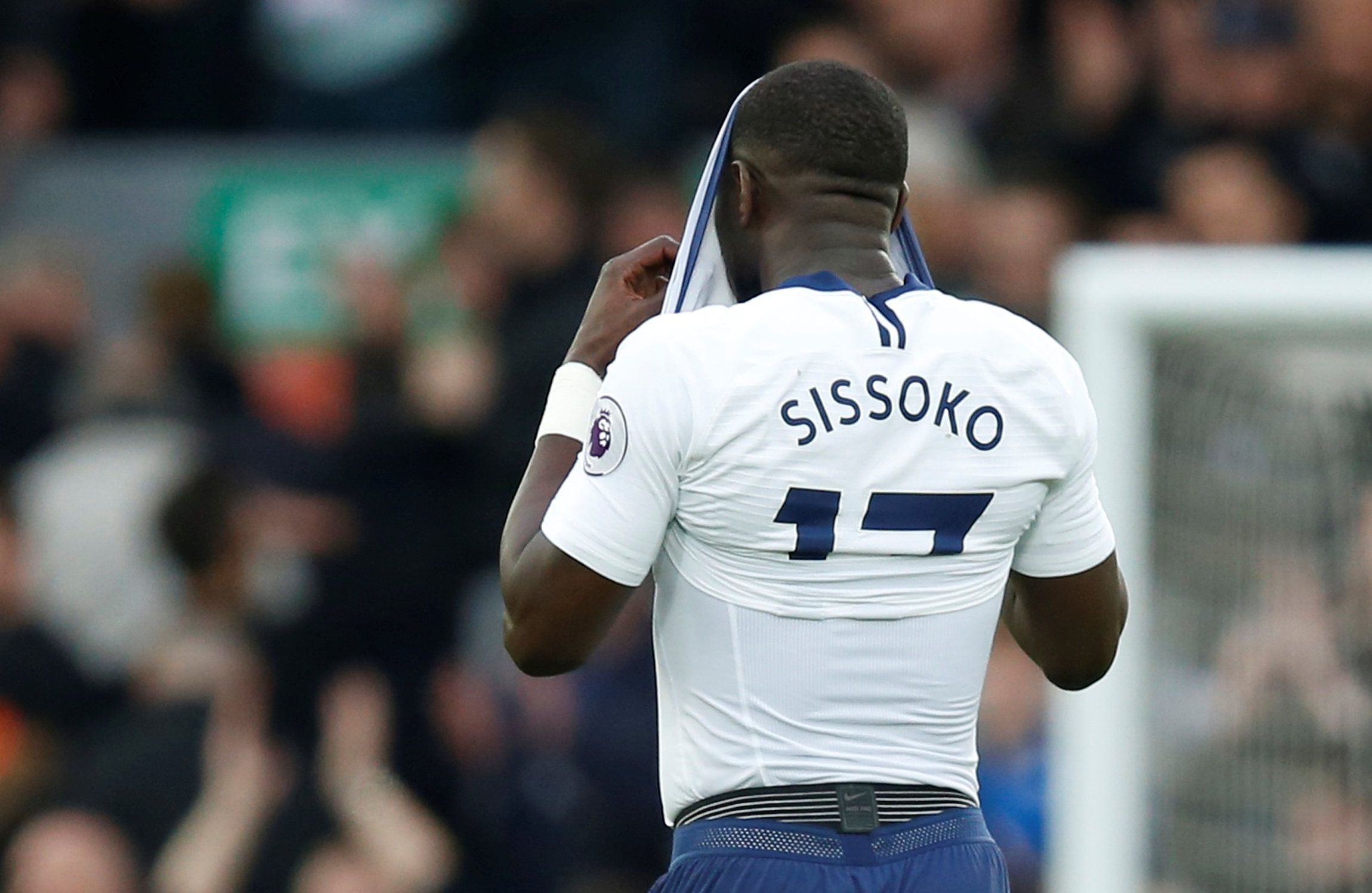 Tottenham midfielder Moussa Sissoko puts his shirt over his head following his missed chance