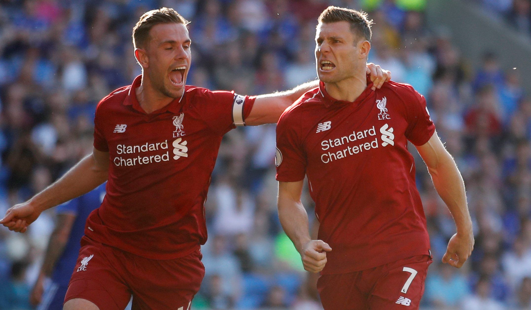 Soccer Football - Premier League - Cardiff City v Liverpool - Cardiff City Stadium, Cardiff, Britain - April 21, 2019   Liverpool's James Milner celebrates scoring their second goal with Jordan Henderson    Action Images via Reuters/Carl Recine    EDITORIAL USE ONLY. No use with unauthorized audio, video, data, fixture lists, club/league logos or 