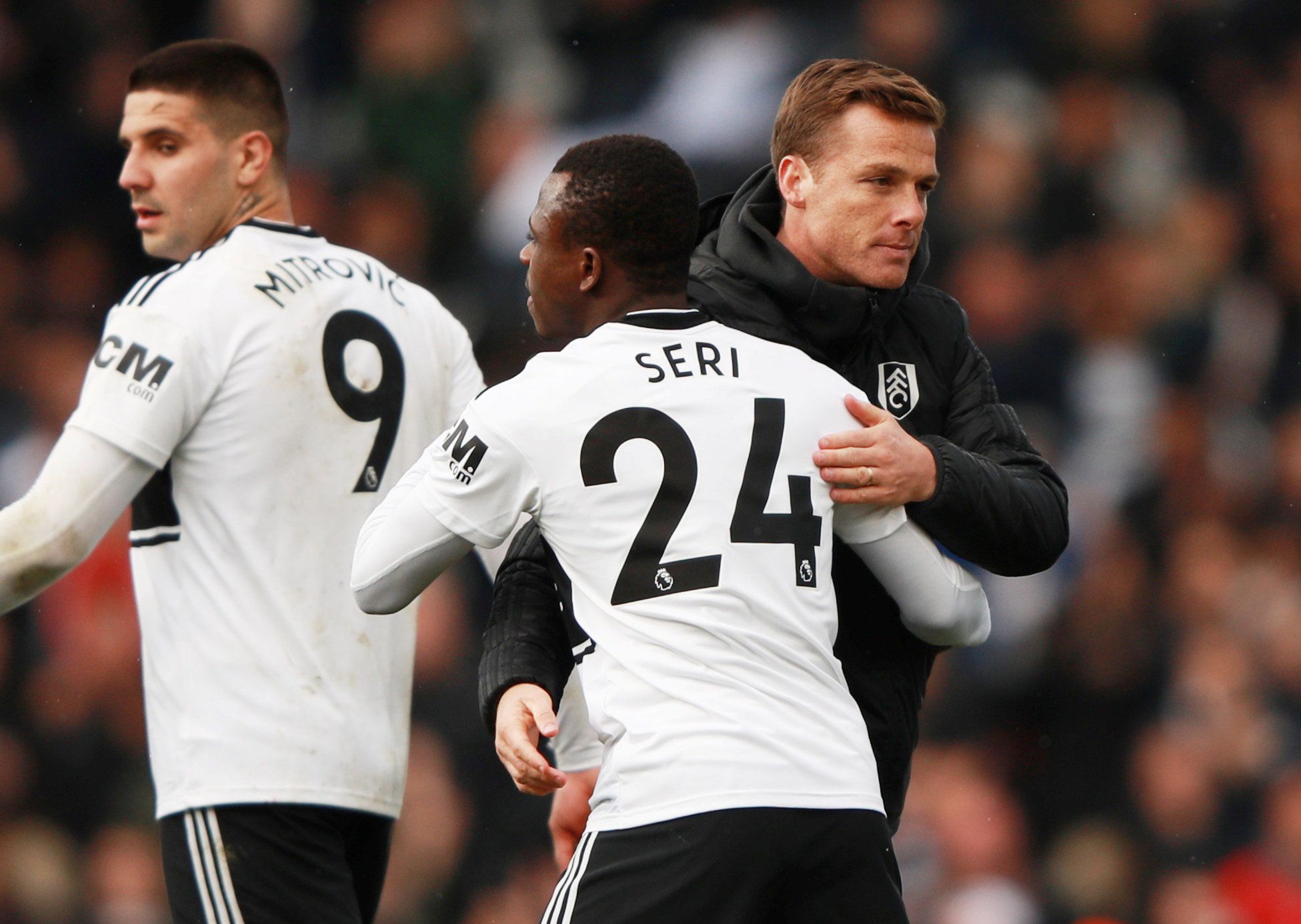 Soccer Football - Premier League - Fulham v Everton - Craven Cottage, London, Britain - April 13, 2019  Fulham caretaker manager Scott Parker celebrates after the match with Jean Michael Seri as Aleksandar Mitrovic looks on  REUTERS/Ian Walton  EDITORIAL USE ONLY. No use with unauthorized audio, video, data, fixture lists, club/league logos or "live" services. Online in-match use limited to 75 images, no video emulation. No use in betting, games or single club/league/player publications.  Please