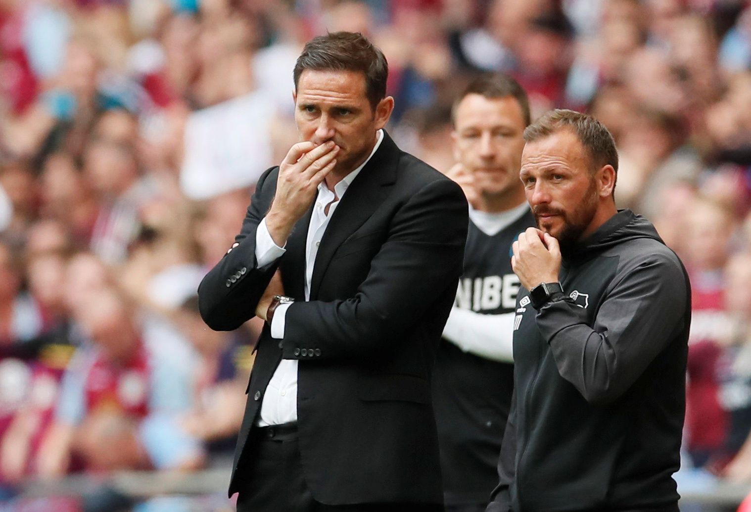 Soccer Football - Championship Playoff Final - Aston Villa v Derby County - Wembley Stadium, London, Britain - May 27, 2019  Derby County manager Frank Lampard talks with assistant manager Jody Morris as Aston Villa assistant manager John Terry looks on  REUTERS/David Klein
