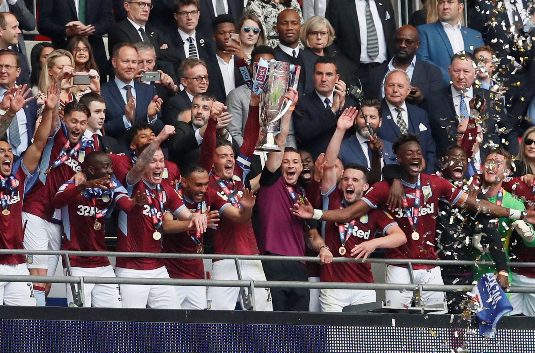Soccer Football - Championship Playoff Final - Aston Villa v Derby County - Wembley Stadium, London, Britain - May 27, 2019  Aston Villa's Jack Grealish and teammates lift trophy as they celebrate winning the playoffs  REUTERS/David Klein       TPX IMAGES OF THE DAY