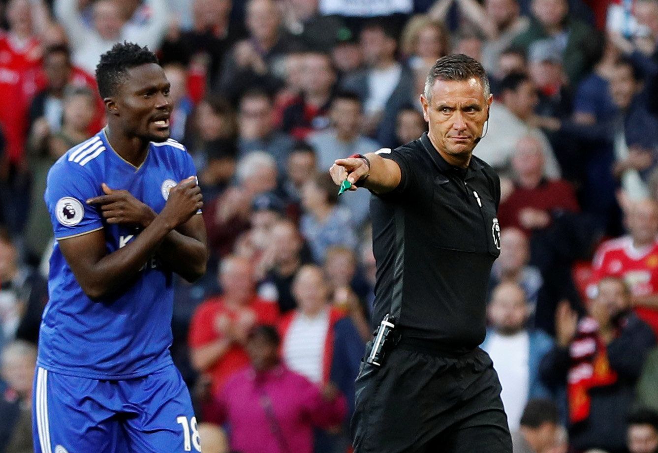 Soccer Football - Premier League - Manchester United v Leicester City - Old Trafford, Manchester, Britain - August 10, 2018  Referee Andre Marriner awards a penalty to Manchester United as Leicester City's Daniel Amartey reacts  Action Images via Reuters/Andrew Boyers  EDITORIAL USE ONLY. No use with unauthorized audio, video, data, fixture lists, club/league logos or 