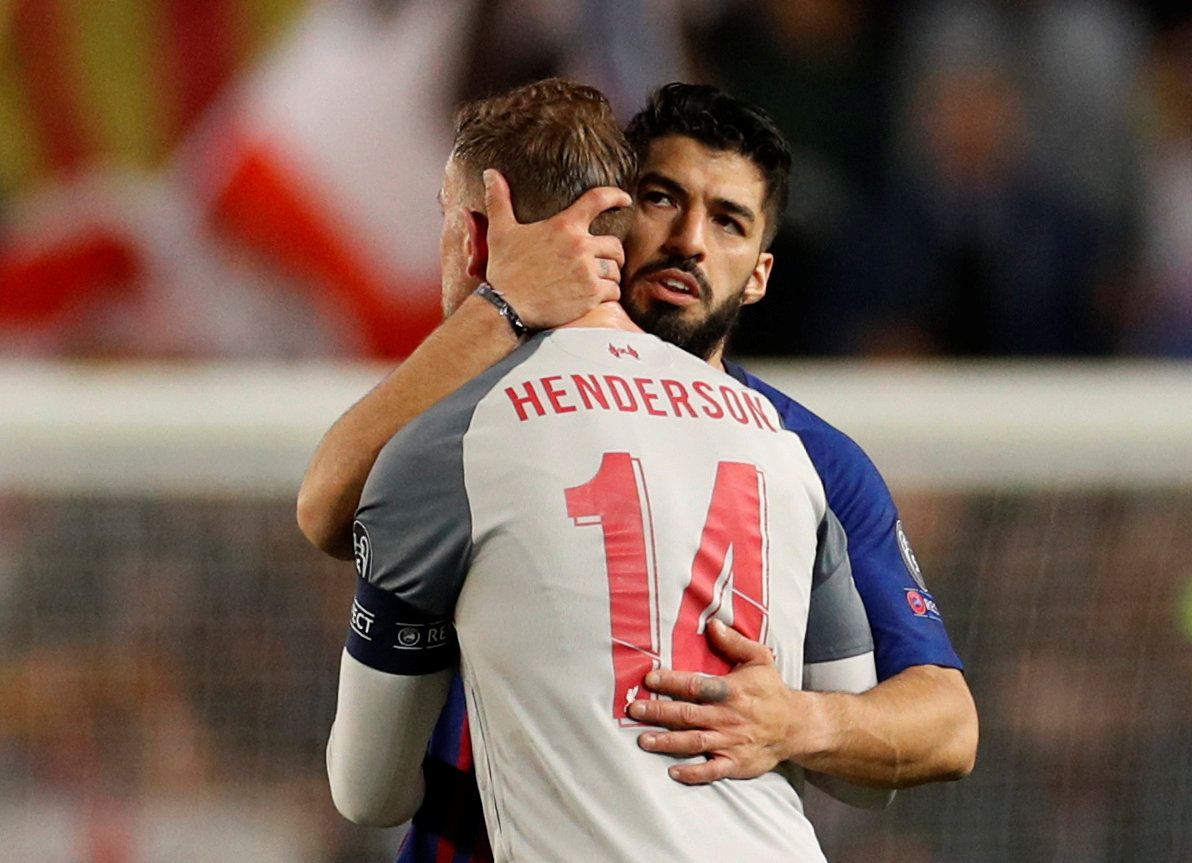 Barcelona striker Luis Suarez embraces former Liverpool teammate Jordan Henderson