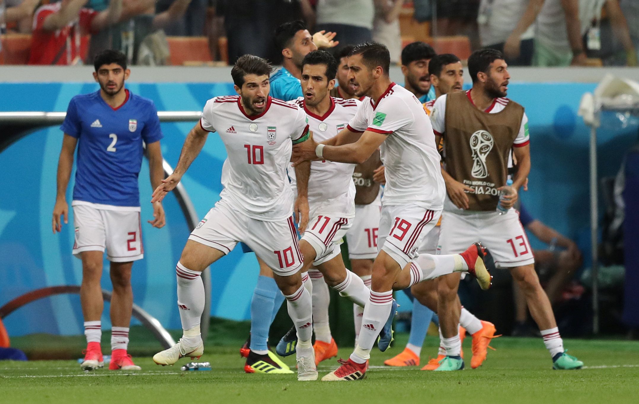 Soccer Football - World Cup - Group B - Iran vs Portugal - Mordovia Arena, Saransk, Russia - June 25, 2018   Iran's Karim Ansarifard celebrates scoring their first goal with Majid Hosseini        REUTERS/Ivan Alvarado