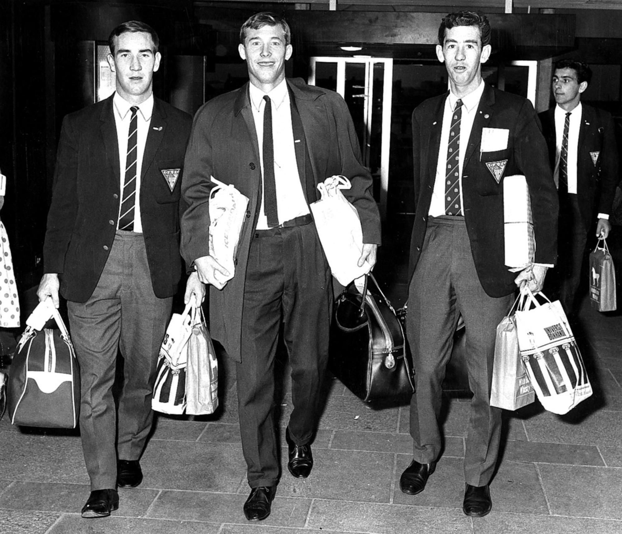Dunfermline Athletic footballer Alex Ferguson and his team mates Jim Fleming and Tommy Callaghan arrive at Glasgow airport after playing in an Inter Cities Fairs cup tie against Frigg Oslo of Norway.
25th August 1966.