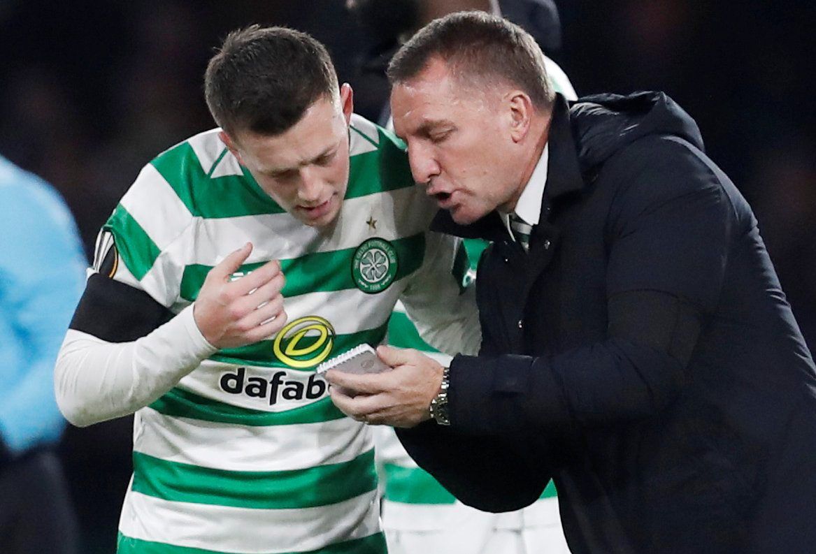 Soccer Football - Europa League - Round of 32 First Leg - Celtic v Valencia - Celtic Park, Glasgow, United Kingdom - February 14, 2019  Celtic's Callum McGregor receives instructions from manager Brendan Rodgers   REUTERS/Russell Cheyne