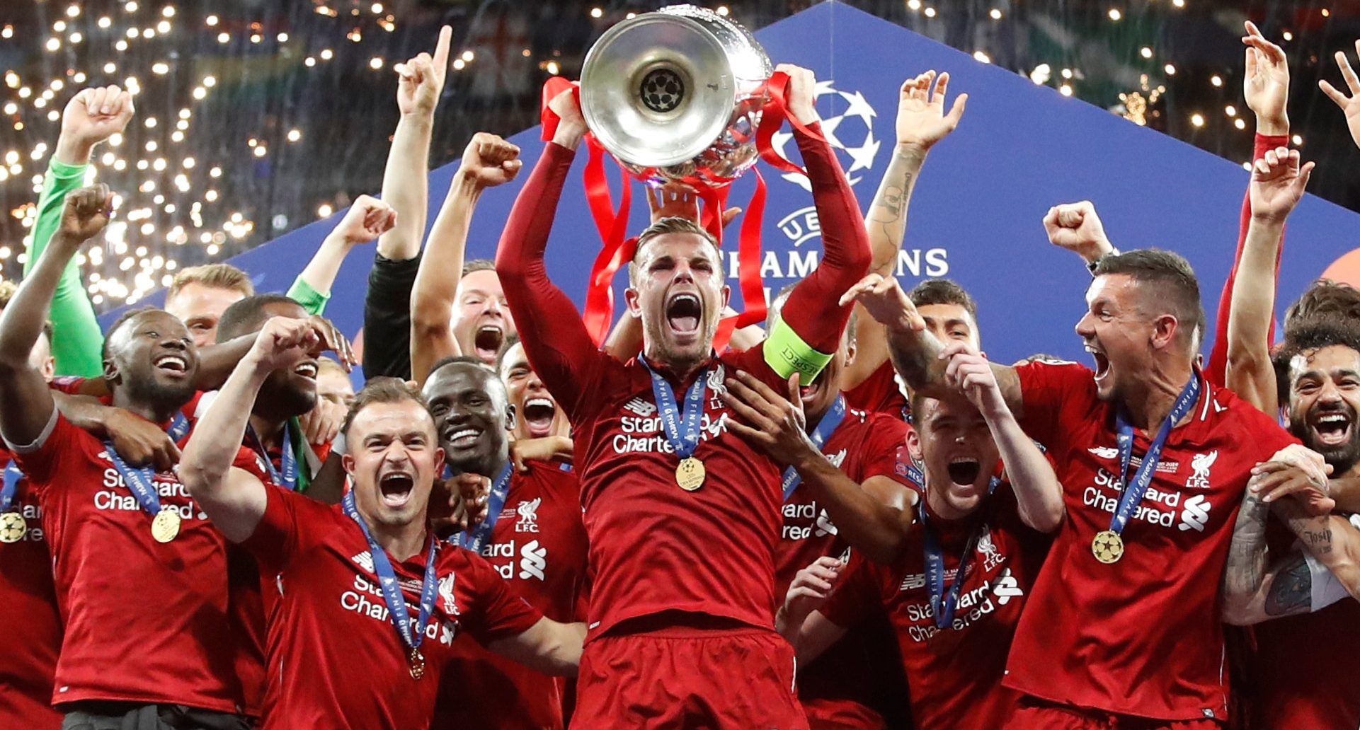 Soccer Football - Champions League Final - Tottenham Hotspur v Liverpool - Wanda Metropolitano, Madrid, Spain - June 1, 2019  Liverpool's Jordan Henderson celebrates with the trophy and teammates after winning the Champions League Final  REUTERS/Carl Recine     TPX IMAGES OF THE DAY