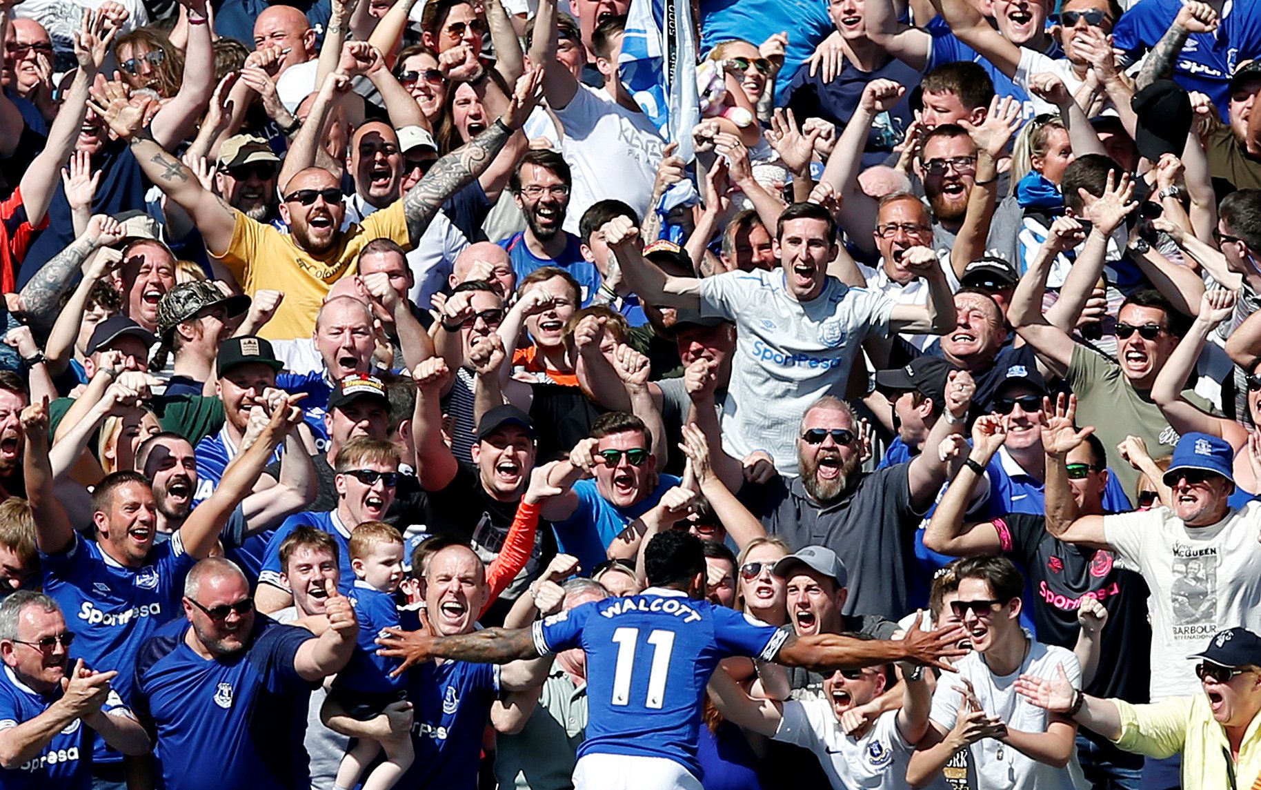 Soccer Football - Premier League - Everton v Manchester United - Goodison Park, Liverpool, Britain - April 21, 2019  Everton's Theo Walcott celebrates scoring their fourth goal with fans                      REUTERS/Andrew Yates  EDITORIAL USE ONLY. No use with unauthorized audio, video, data, fixture lists, club/league logos or 