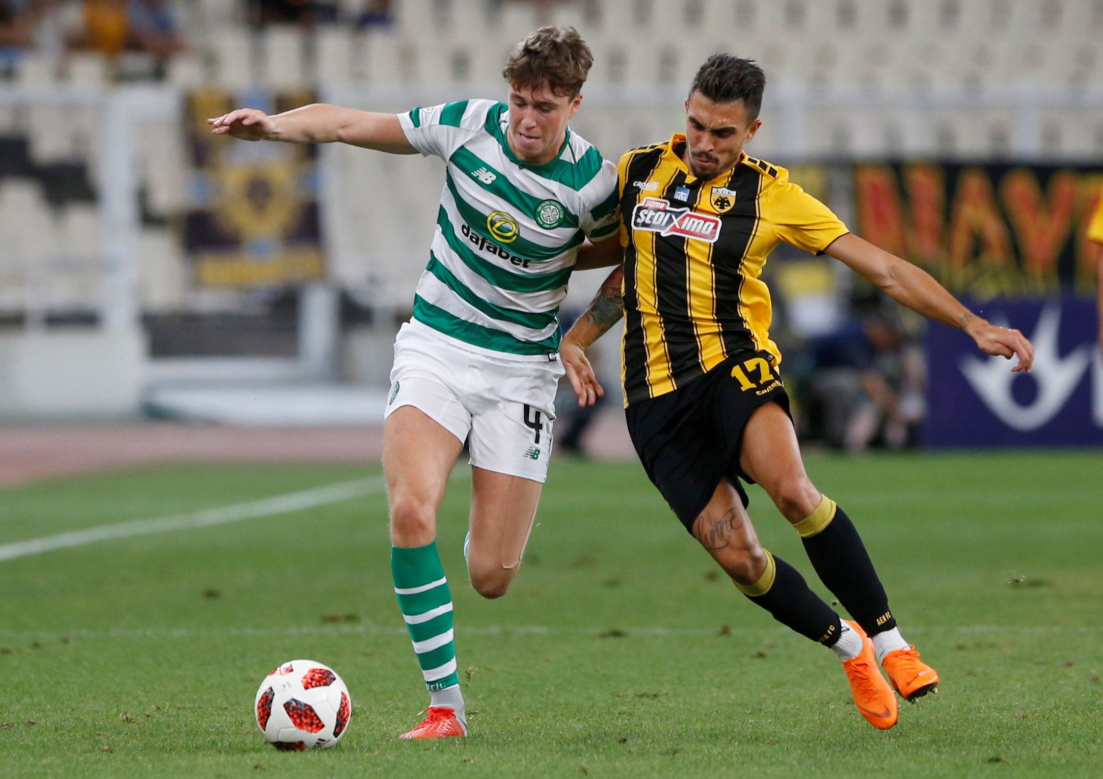 Soccer Football - Champions League - Third Qualifying Round Second Leg - AEK Athens v Celtic - Athens Olympic Stadium, Athens, Greece - August 14, 2018  Celtic's Jack Hendry in action with AEK Athens' Viktor Klonaridis   REUTERS/Alkis Konstantinidis
