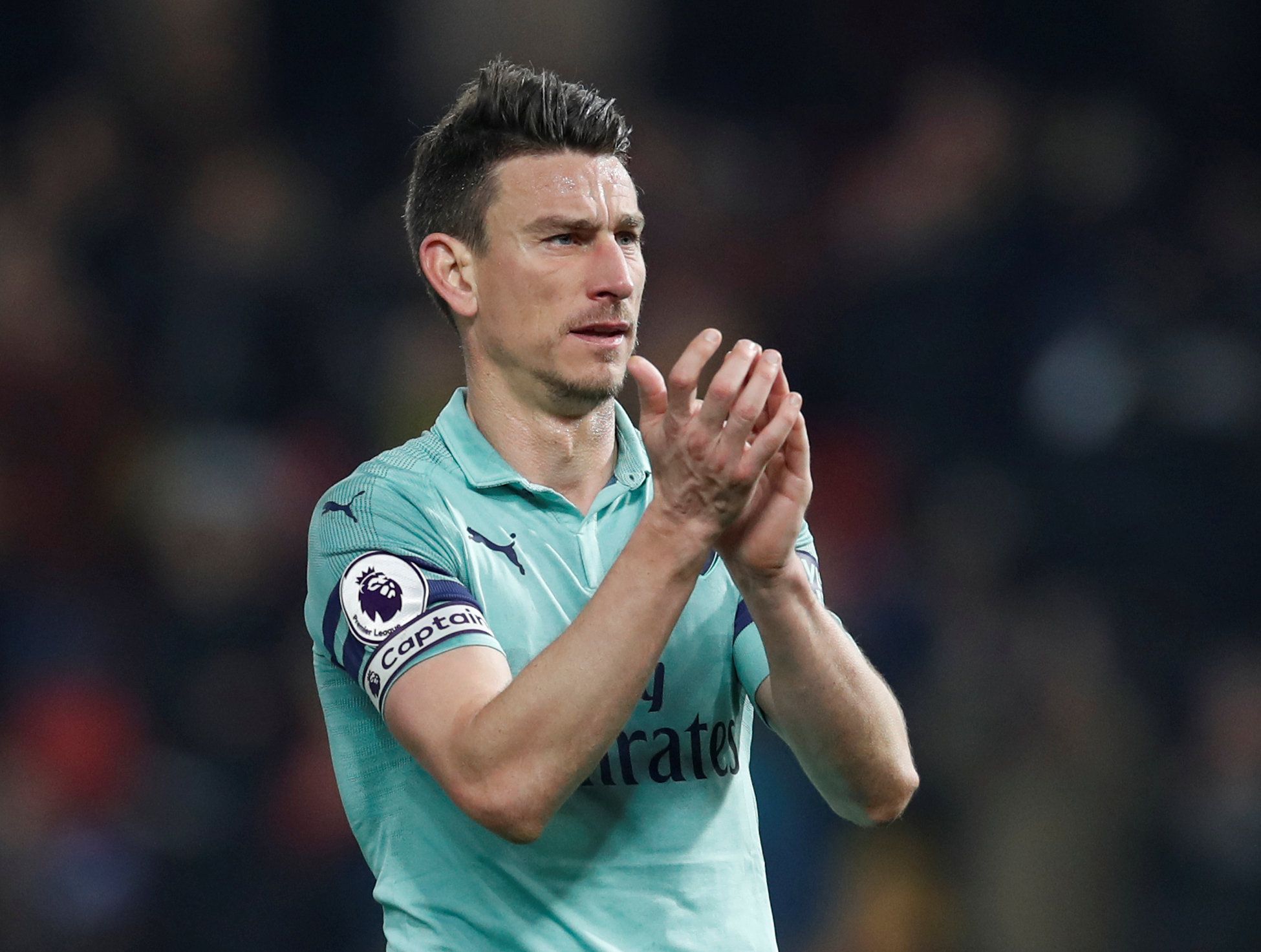 Soccer Football - Premier League - Watford v Arsenal - Vicarage Road, Watford, Britain - April 15, 2019  Arsenal's Laurent Koscielny applauds fans after the match        REUTERS/David Klein  EDITORIAL USE ONLY. No use with unauthorized audio, video, data, fixture lists, club/league logos or 