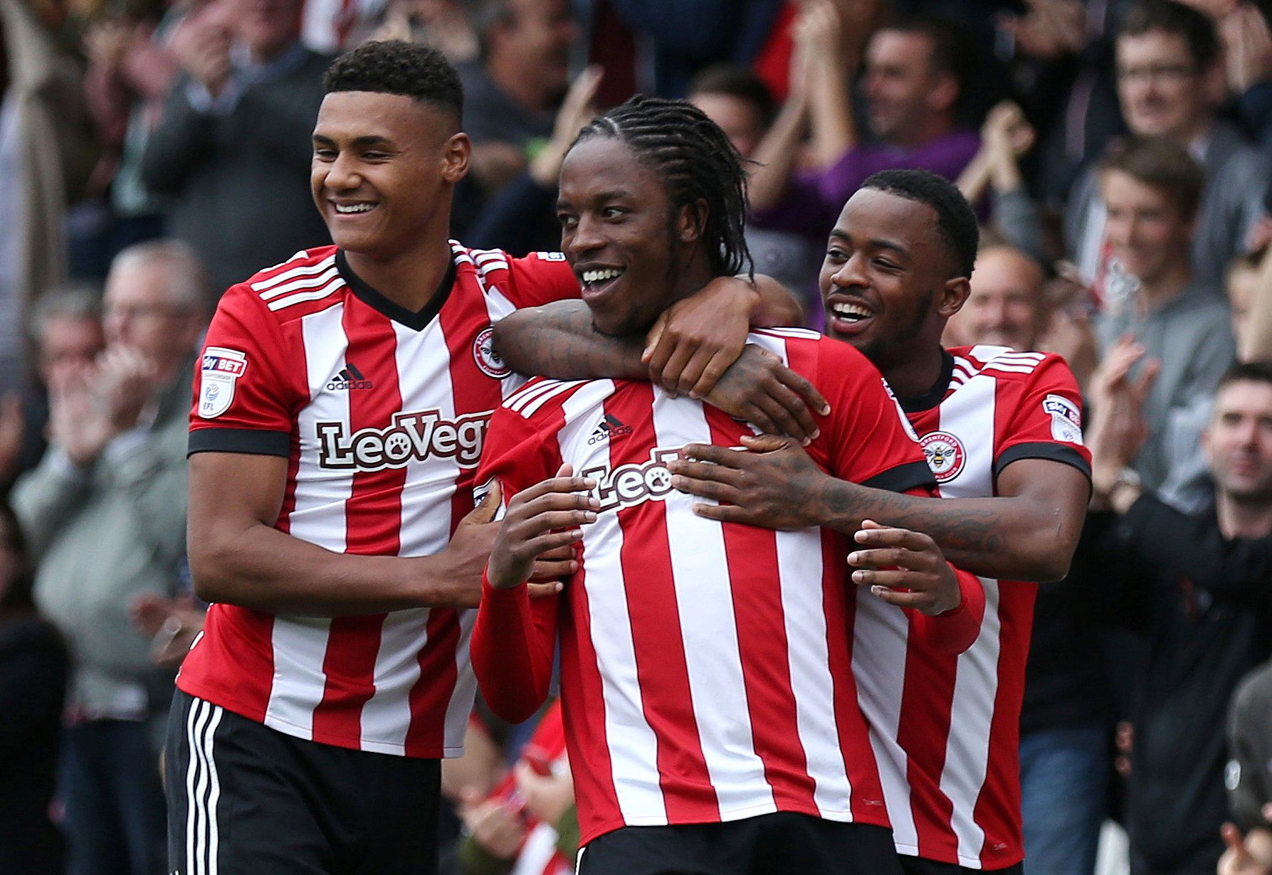 Soccer Football - Championship - Brentford vs Millwall - Griffin Park, Brentford, Britain - October 14, 2017  Brentford's Romaine Sawyers celebrates scoring their first goal with team mates  Action Images/Tom Jacobs  EDITORIAL USE ONLY. No use with unauthorized audio, video, data, fixture lists, club/league logos or 