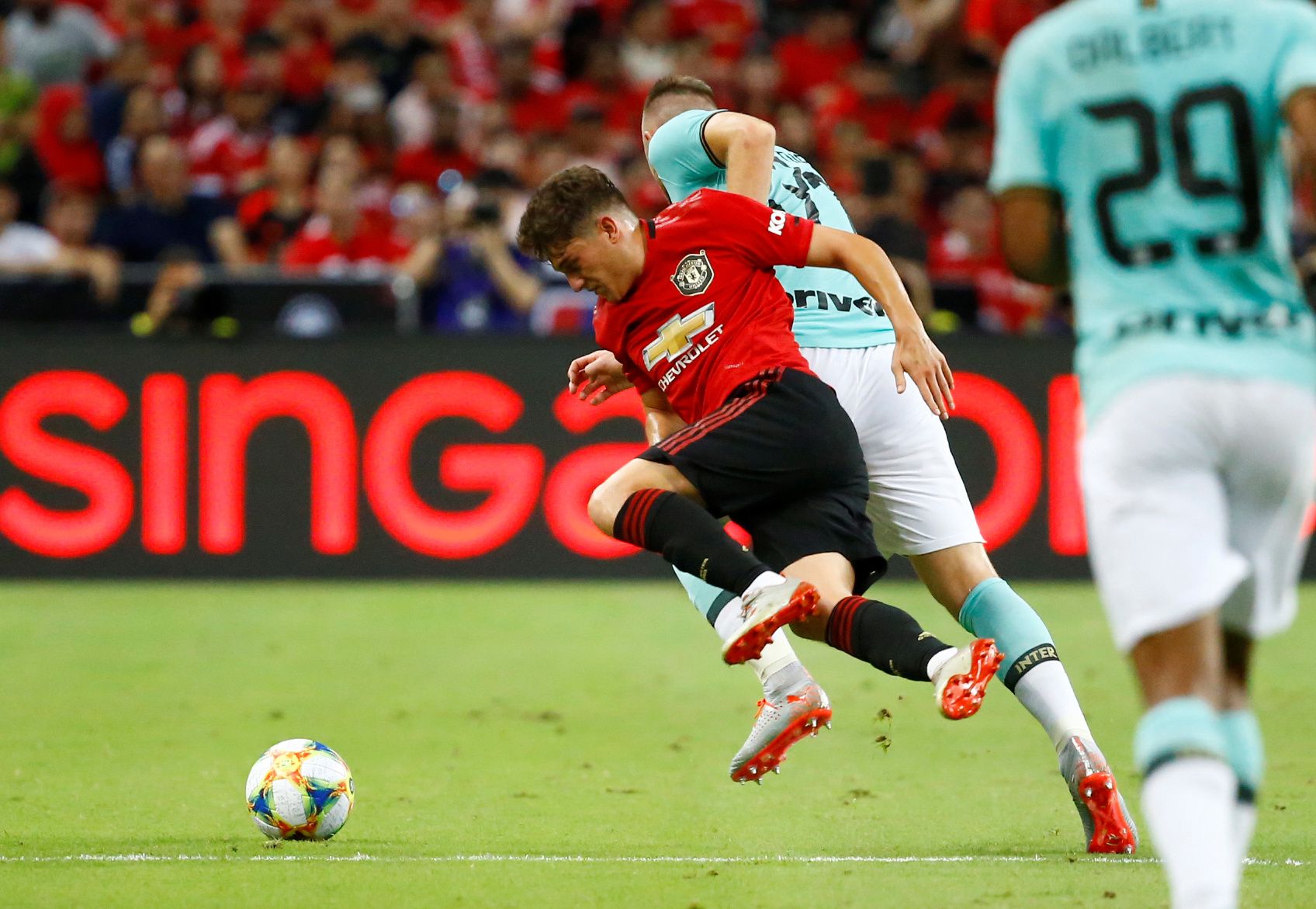 Soccer Football - International Champions Cup - Manchester United v Inter Milan - Singapore National Stadium, Singapore - July 20, 2019  Manchester United's Daniel James in action with Inter Milan's Milan Skriniar  REUTERS/Feline Lim