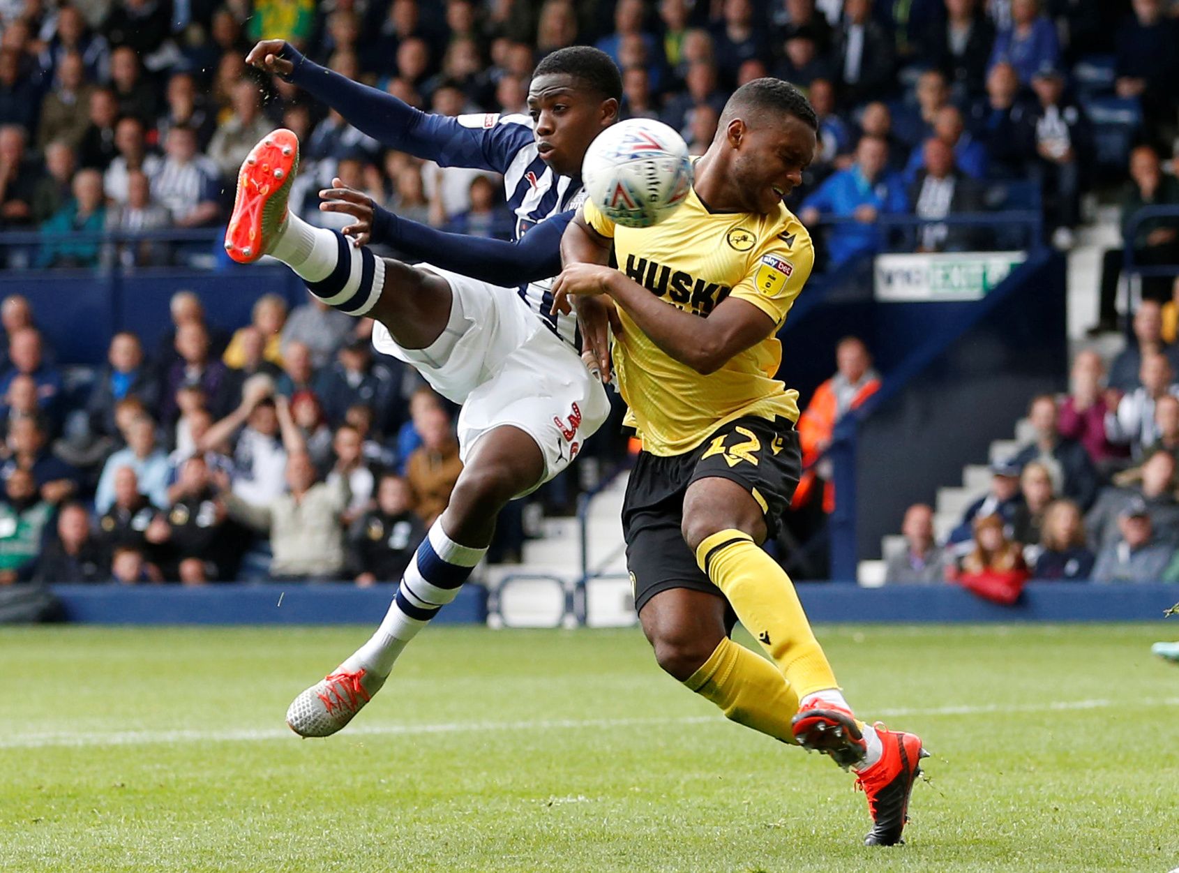 Soccer Football - Championship - West Bromwich Albion v Millwall - The Hawthorns, West Bromwich, Britain - August 10, 2019  Millwall's Mahlon Romeo sustains an injury whilst in action with West Bromwich Albion's Nathan Ferguson   Action Images/Ed Sykes  EDITORIAL USE ONLY. No use with unauthorized audio, video, data, fixture lists, club/league logos or 