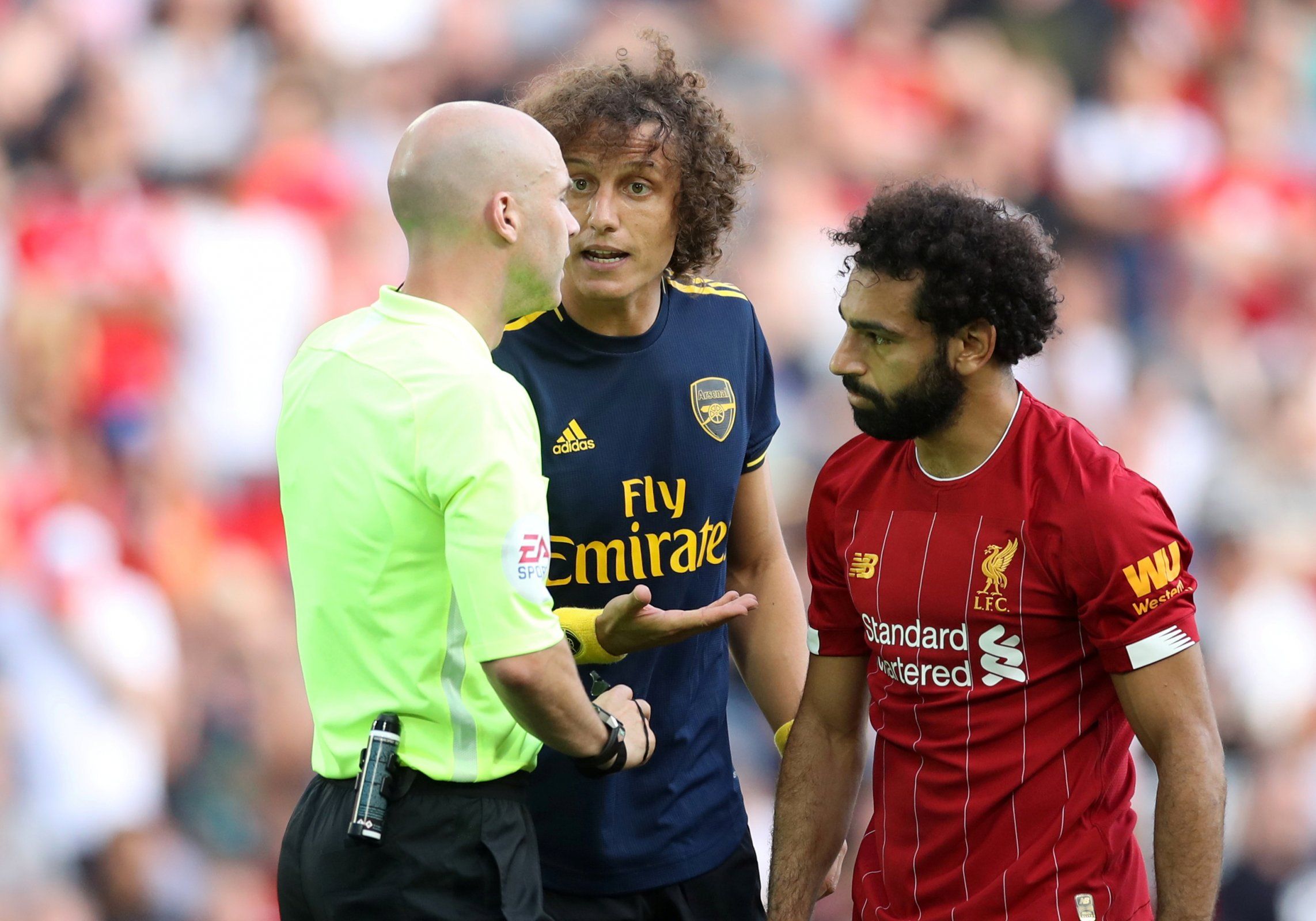 David Luiz gets a word from the referee