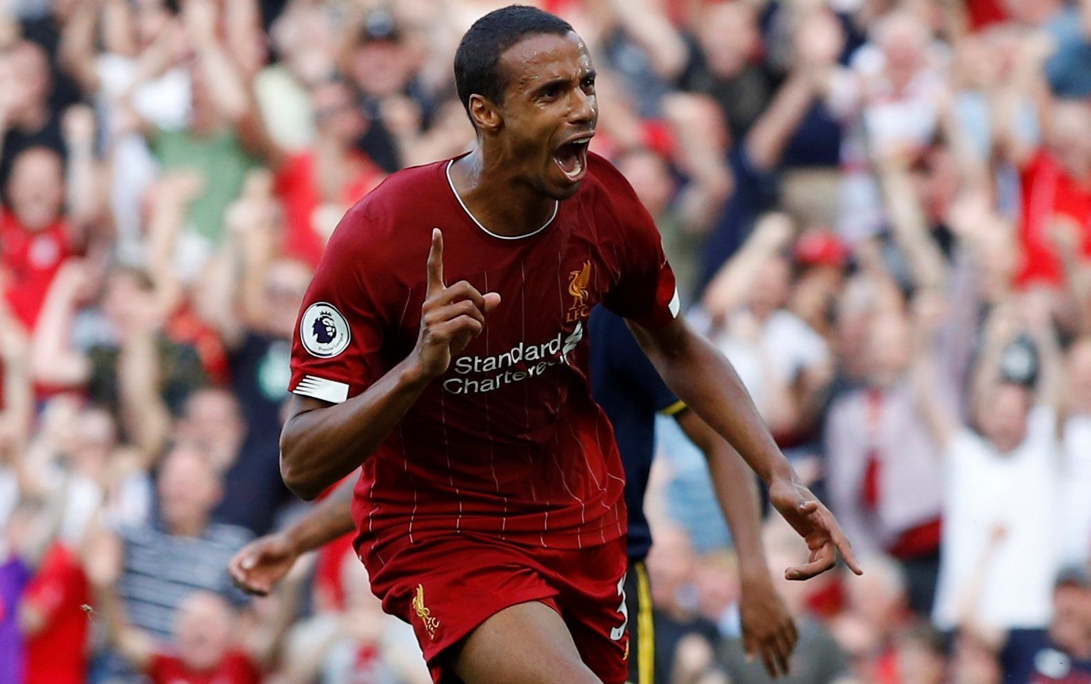 Soccer Football - Premier League - Liverpool v Arsenal - Anfield, Liverpool, Britain - August 24, 2019  Liverpool's Joel Matip celebrates scoring their first goal   REUTERS/Phil Noble  EDITORIAL USE ONLY. No use with unauthorized audio, video, data, fixture lists, club/league logos or 
