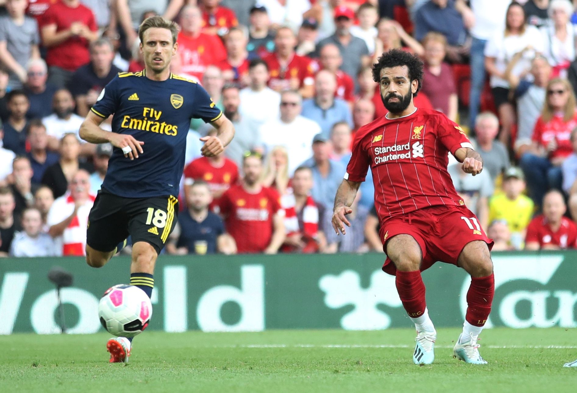 Soccer Football - Premier League - Liverpool v Arsenal - Anfield, Liverpool, Britain - August 24, 2019  Liverpool's Mohamed Salah scores their third goal  Action Images via Reuters/Carl Recine  EDITORIAL USE ONLY. No use with unauthorized audio, video, data, fixture lists, club/league logos or 