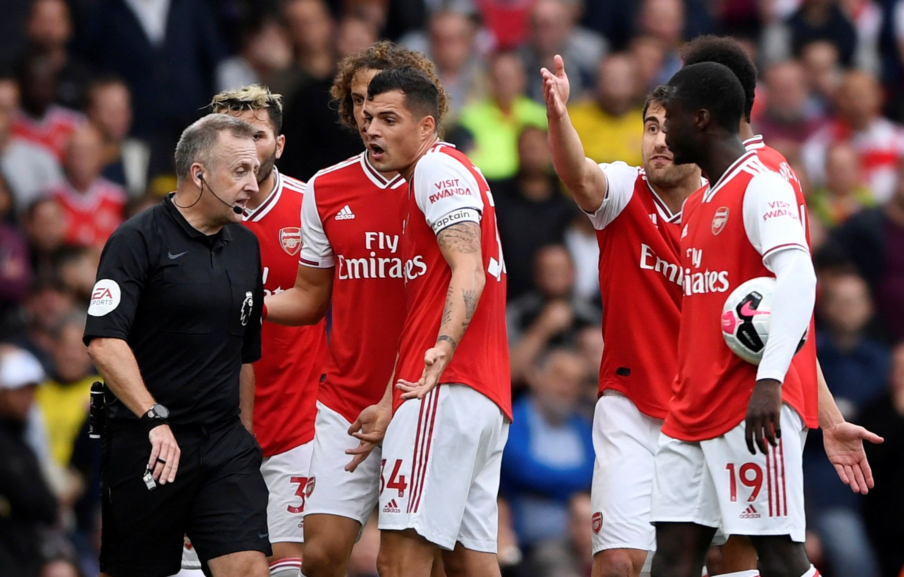Soccer Football - Premier League - Arsenal v Aston Villa - Emirates Stadium, London, Britain - September 22, 2019  Arsenal's Granit Xhaka remonstrates with referee Jonathon Moss  Action Images via Reuters/Tony O'Brien  EDITORIAL USE ONLY. No use with unauthorized audio, video, data, fixture lists, club/league logos or 