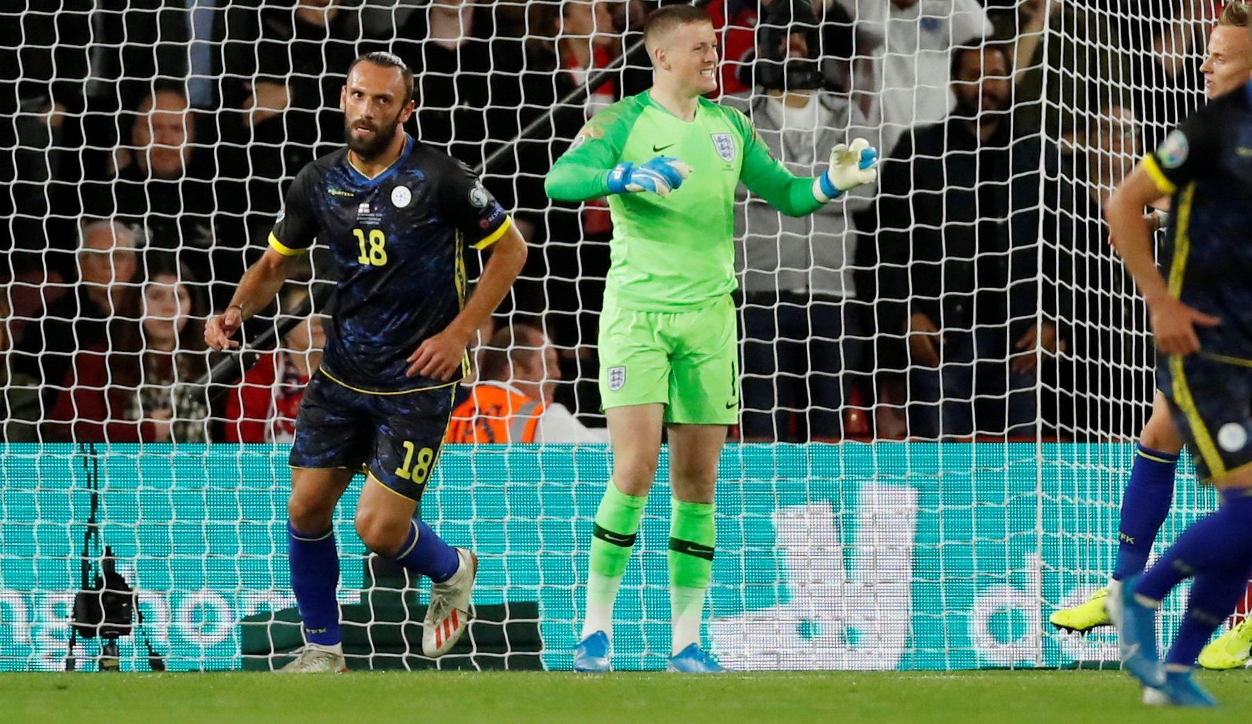 Soccer Football - Euro 2020 Qualifier - Group A - England v Kosovo - St Mary's Stadium, Southampton, Britain - September 10, 2019  Kosovo's Vedat Muriqi celebrates scoring their third goal as England's Jordan Pickford looks dejected   Action Images via Reuters/Andrew Boyers