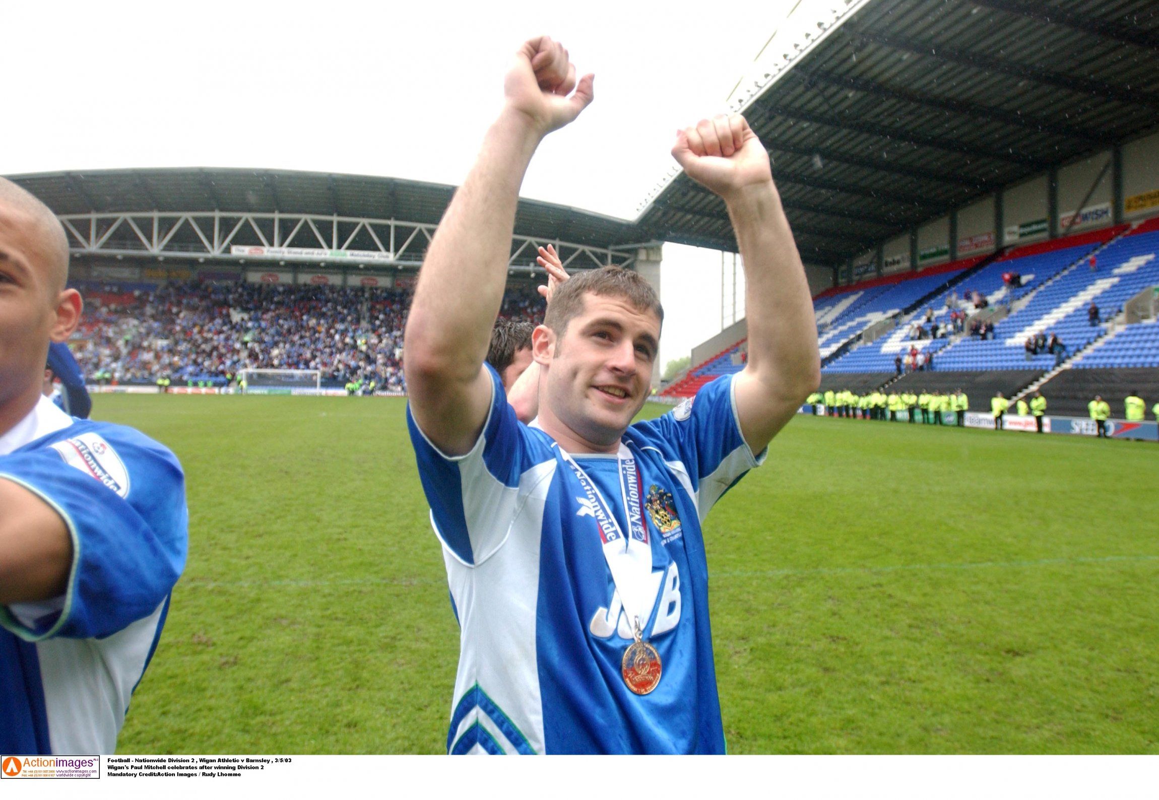 Paul Mitchell celebrates winning Division 2 with Wigan