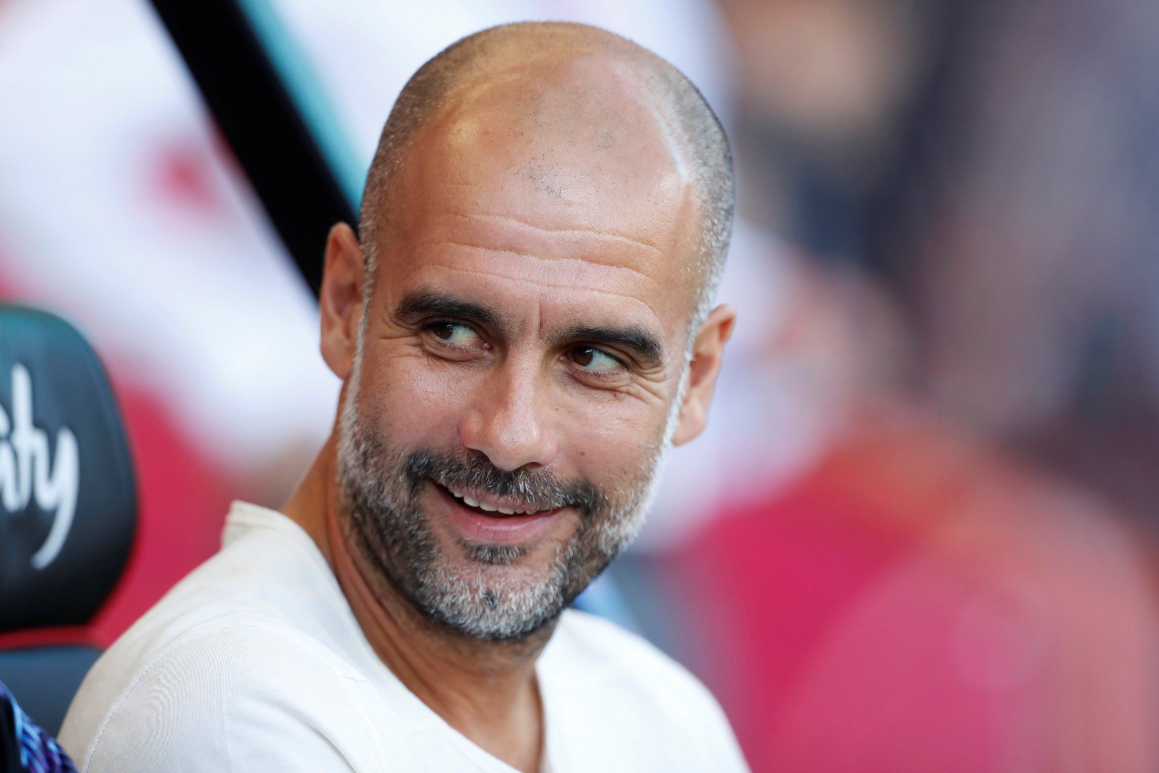 Pep Guardiola smiling before match against Bournemouth