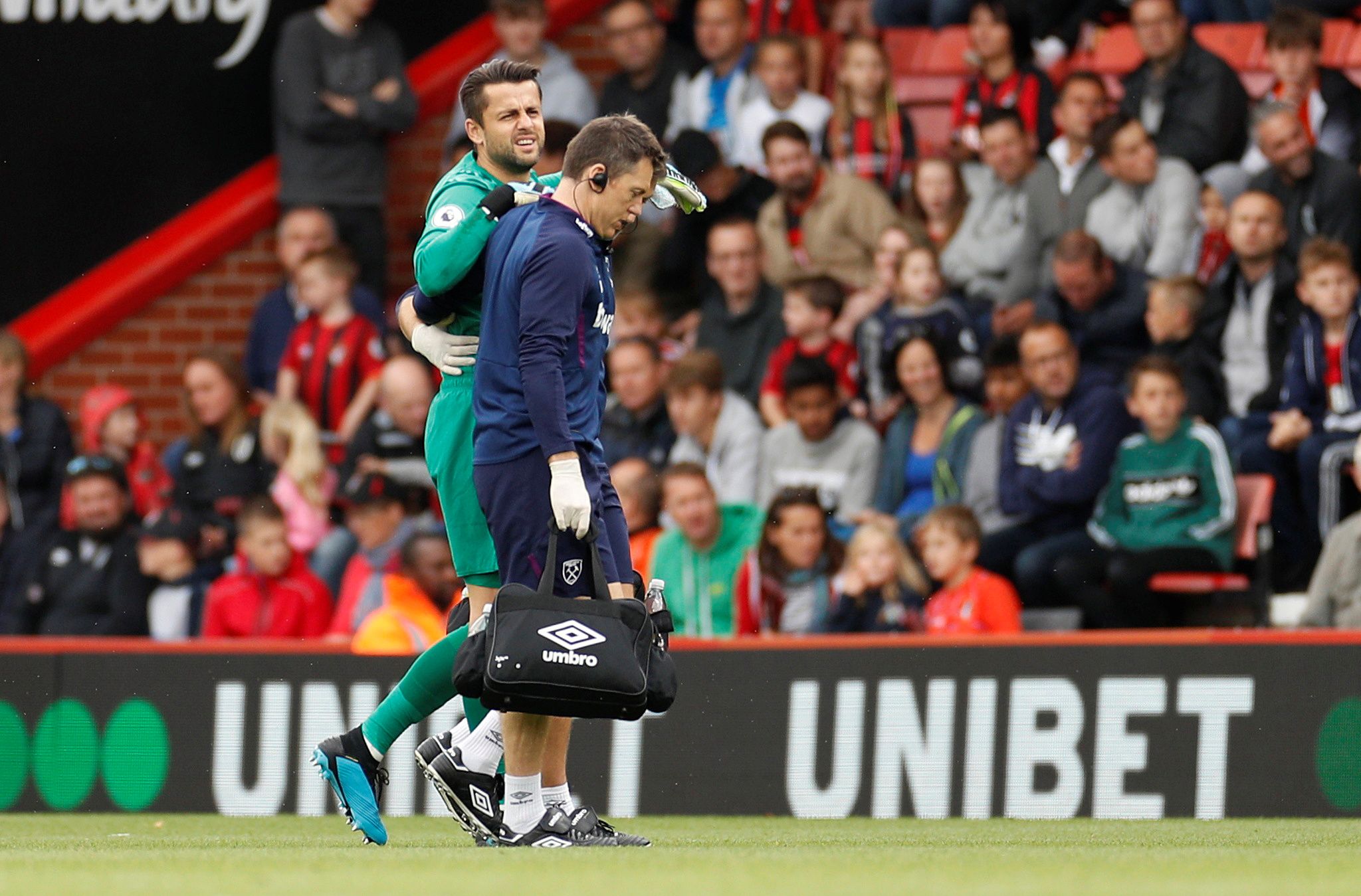 Soccer Football - Premier League - AFC Bournemouth v West Ham United - Vitality Stadium, Bournemouth, Britain - September 28, 2019  West Ham United's Lukasz Fabianski is helped off the pitch by medical staff after sustaining an injury   Action Images via Reuters/John Sibley  EDITORIAL USE ONLY. No use with unauthorized audio, video, data, fixture lists, club/league logos or 