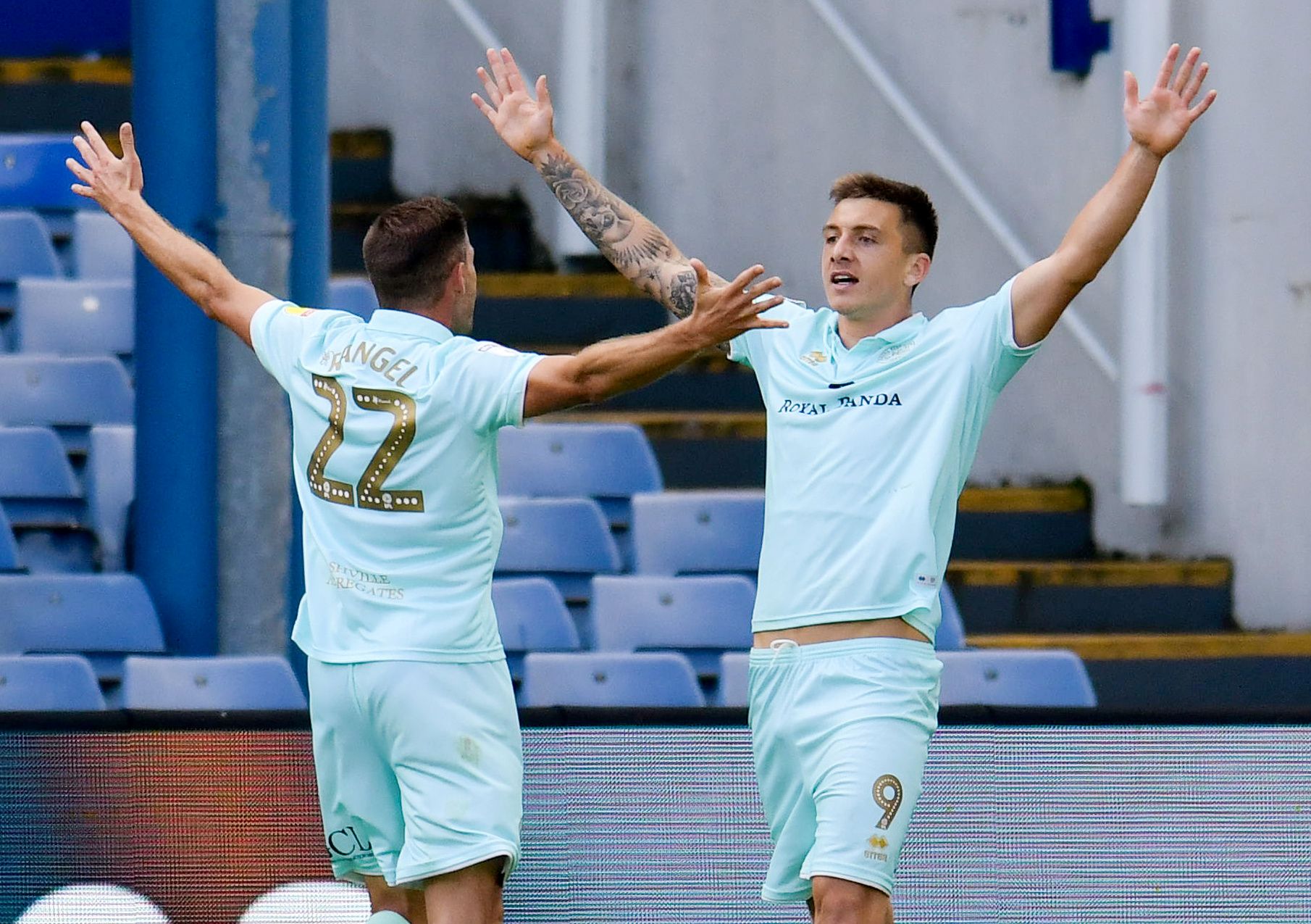 Soccer Football - Championship - Sheffield Wednesday v Queens Park Rangers - Hillsborough, Sheffield, Britain - August 31, 2019   Queens Park Rangers' Jordan Hugill celebrates scoring their first goal with Angel Rangel   Action Images/Paul Burrows    EDITORIAL USE ONLY. No use with unauthorized audio, video, data, fixture lists, club/league logos or "live" services. Online in-match use limited to 75 images, no video emulation. No use in betting, games or single club/league/player publications.  