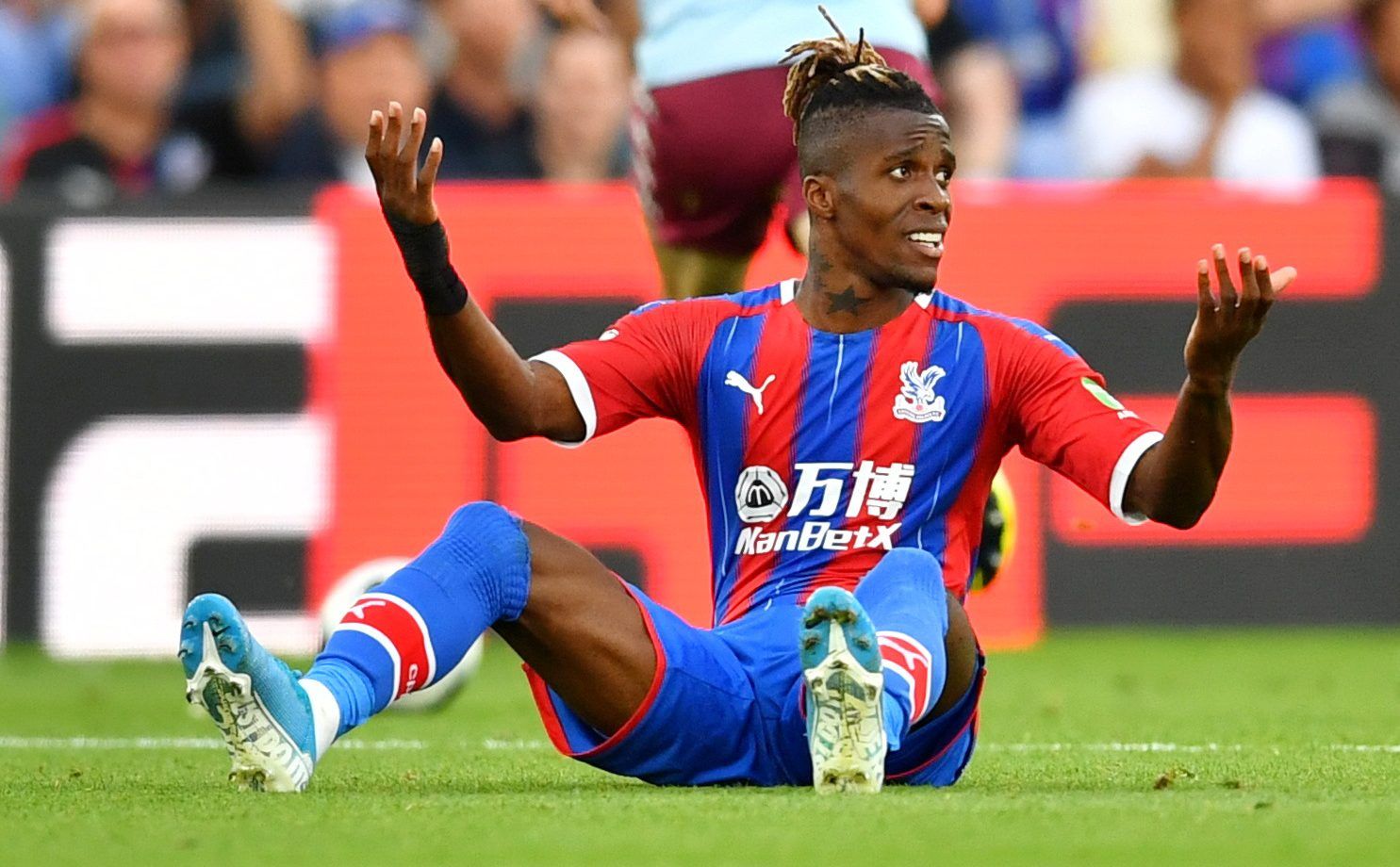 Soccer Football - Premier League - Crystal Palace v Aston Villa - Selhurst Park, London, Britain - August 31, 2019  Crystal Palace's Wilfried Zaha reacts              REUTERS/Dylan Martinez  EDITORIAL USE ONLY. No use with unauthorized audio, video, data, fixture lists, club/league logos or 