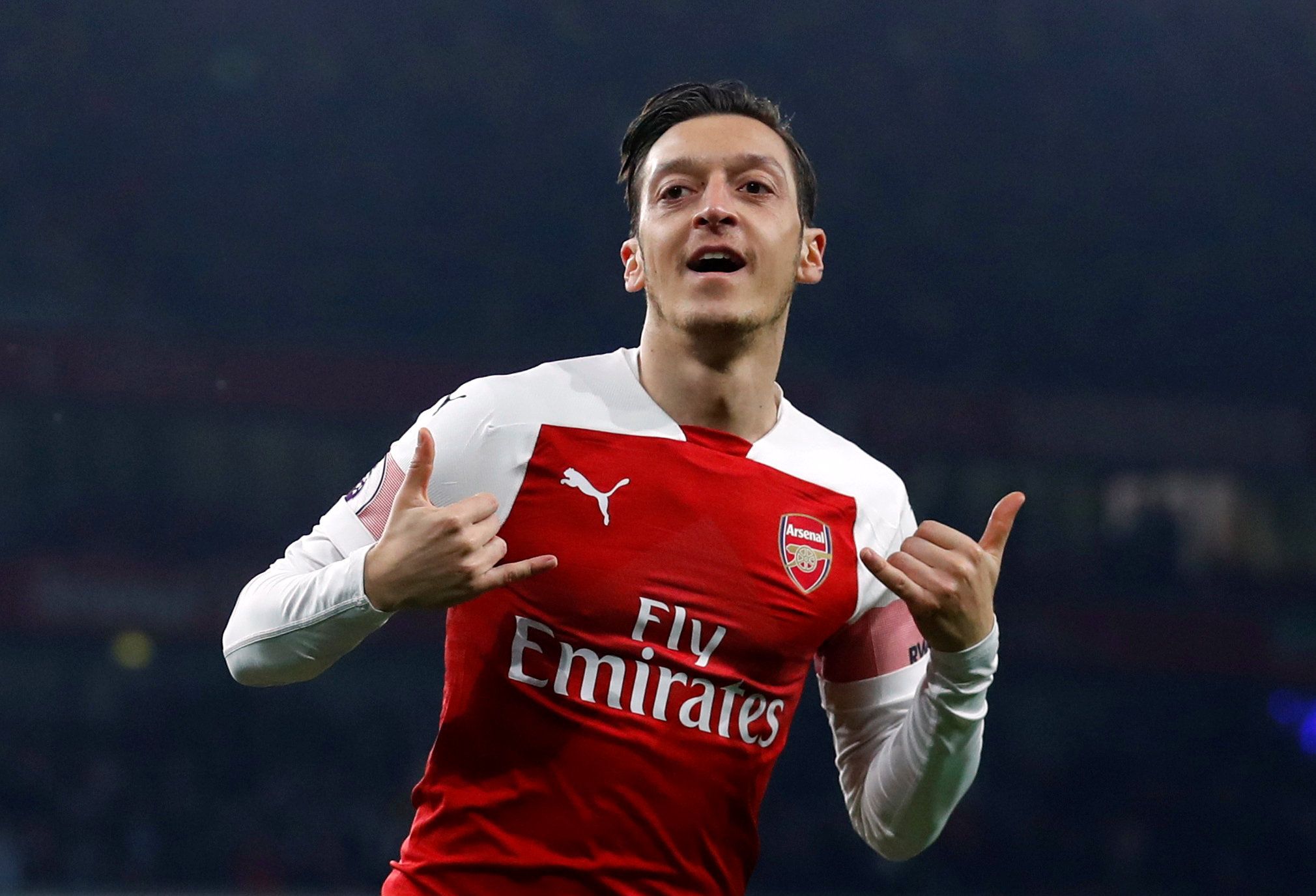 Soccer Football - Premier League - Arsenal v AFC Bournemouth - Emirates Stadium, London, Britain - February 27, 2019  Arsenal's Mesut Ozil celebrates scoring their first goal      REUTERS/Eddie Keogh  EDITORIAL USE ONLY. No use with unauthorized audio, video, data, fixture lists, club/league logos or 
