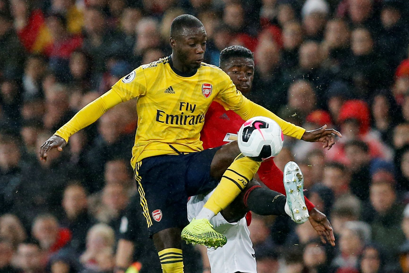 Soccer Football - Premier League - Manchester United v Arsenal - Old Trafford, Manchester, Britain - September 30, 2019   Arsenal's Nicolas Pepe in action    REUTERS/Andrew Yates    EDITORIAL USE ONLY. No use with unauthorized audio, video, data, fixture lists, club/league logos or 