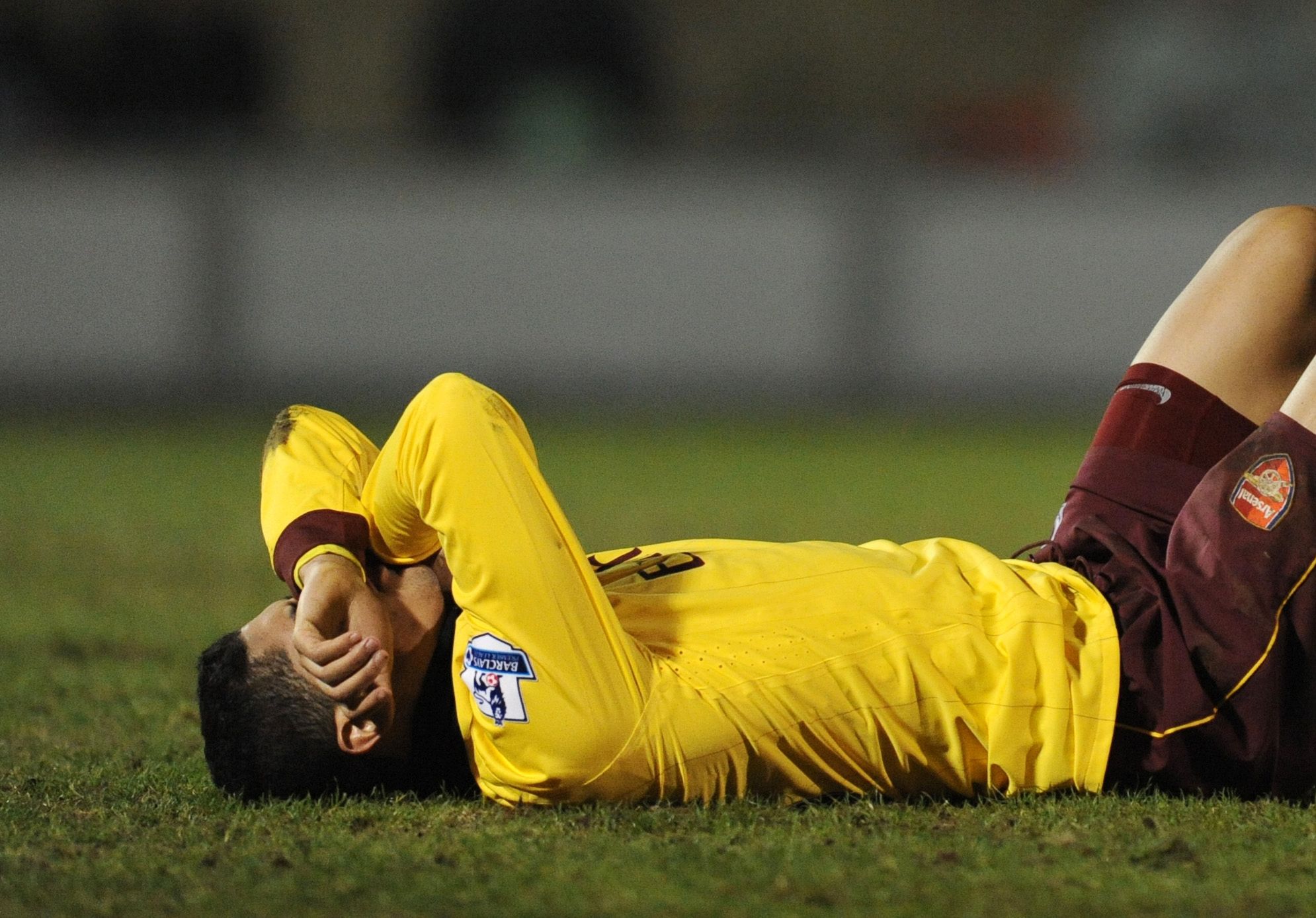Football - Leyton Orient v Arsenal FA Cup Fifth Round  - The Matchroom Stadium, Brisbane Road - 10/11 - 20/2/11 
Arsenal's Denilson lies on the picth after appearing to sustain an injury 
Mandatory Credit: Action Images / Tony O'Brien 
Livepic