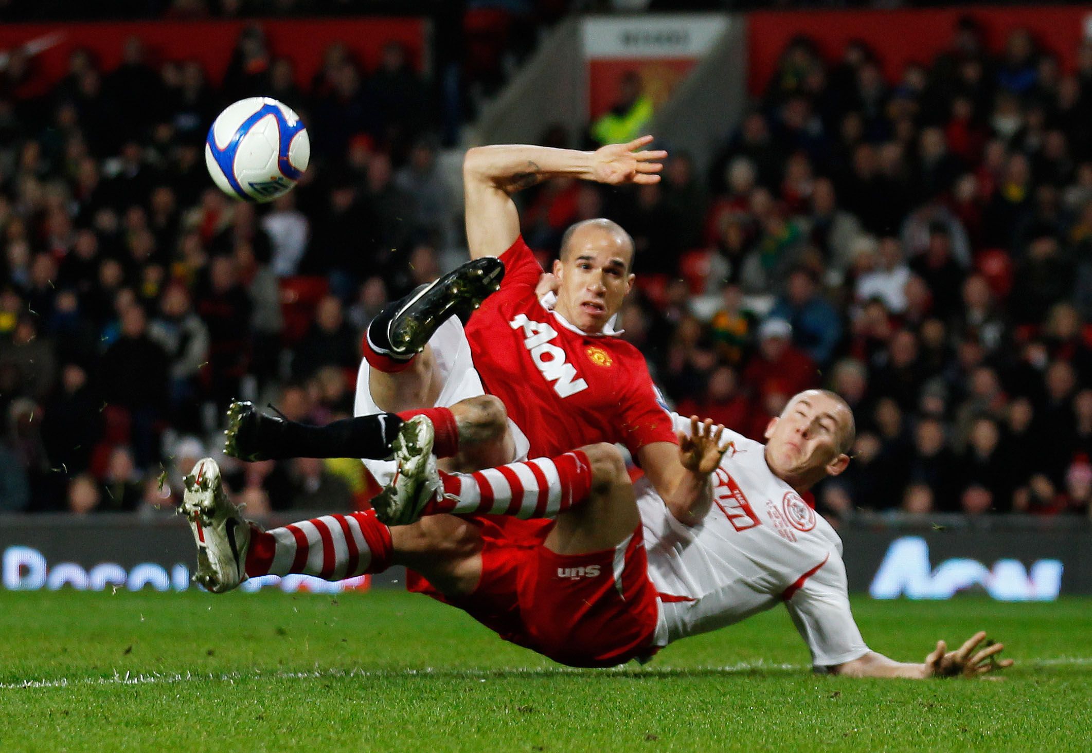 Football - Manchester United v Crawley Town FA Cup Fifth Round  - Old Trafford  -  10/11 - 19/2/11 
Manchester United's Gabriel Obertan and Kyle McFadzean (R) of Crawley Town in action 
Mandatory Credit: Action Images / Jason Cairnduff 
Livepic