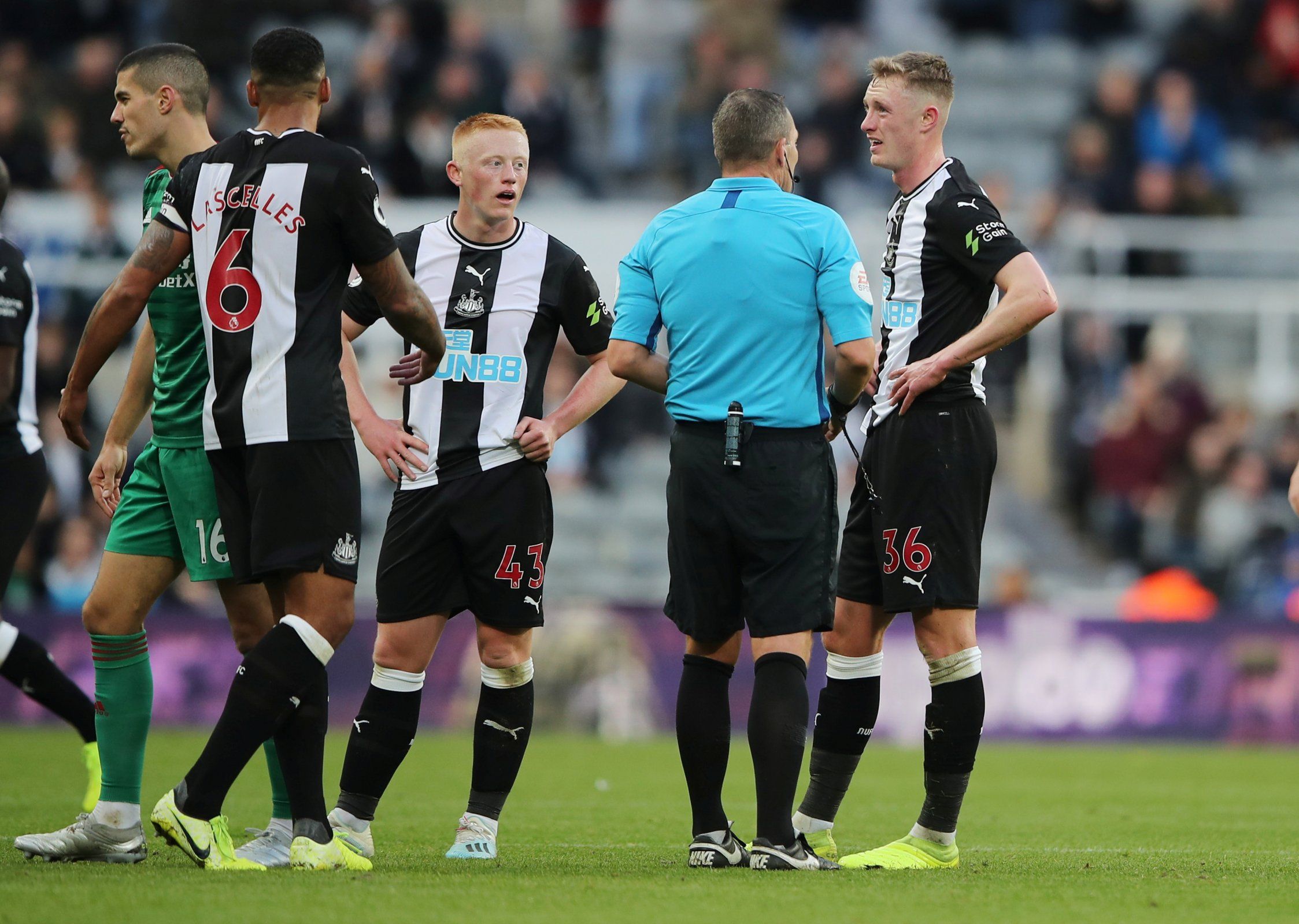 Newcastle United's Sean Longstaff is shown a red card by referee Kevin Friend after fouling Wolverhampton Wanderers' Ruben Neves