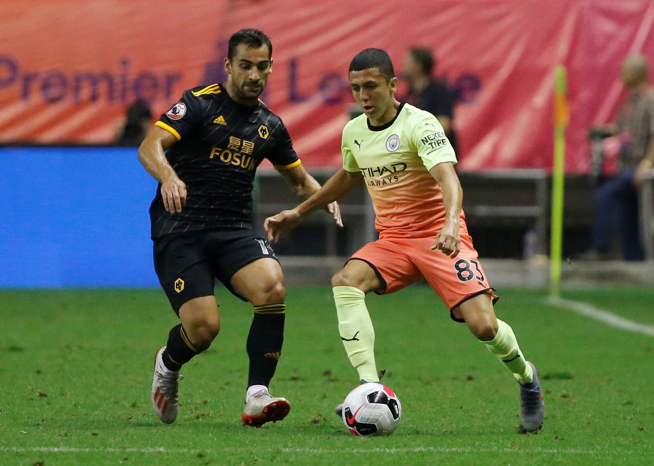 Soccer Football - Premier League Asia Trophy - Wolverhampton Wanderers v Manchester City - Hongkou Football Stadium, Shanghai, China - July 20, 2019  Manchester City's Ian Carlo Poveda in action with Wolverhampton Wanderers' Jonny Castro   REUTERS/Thomas Peter