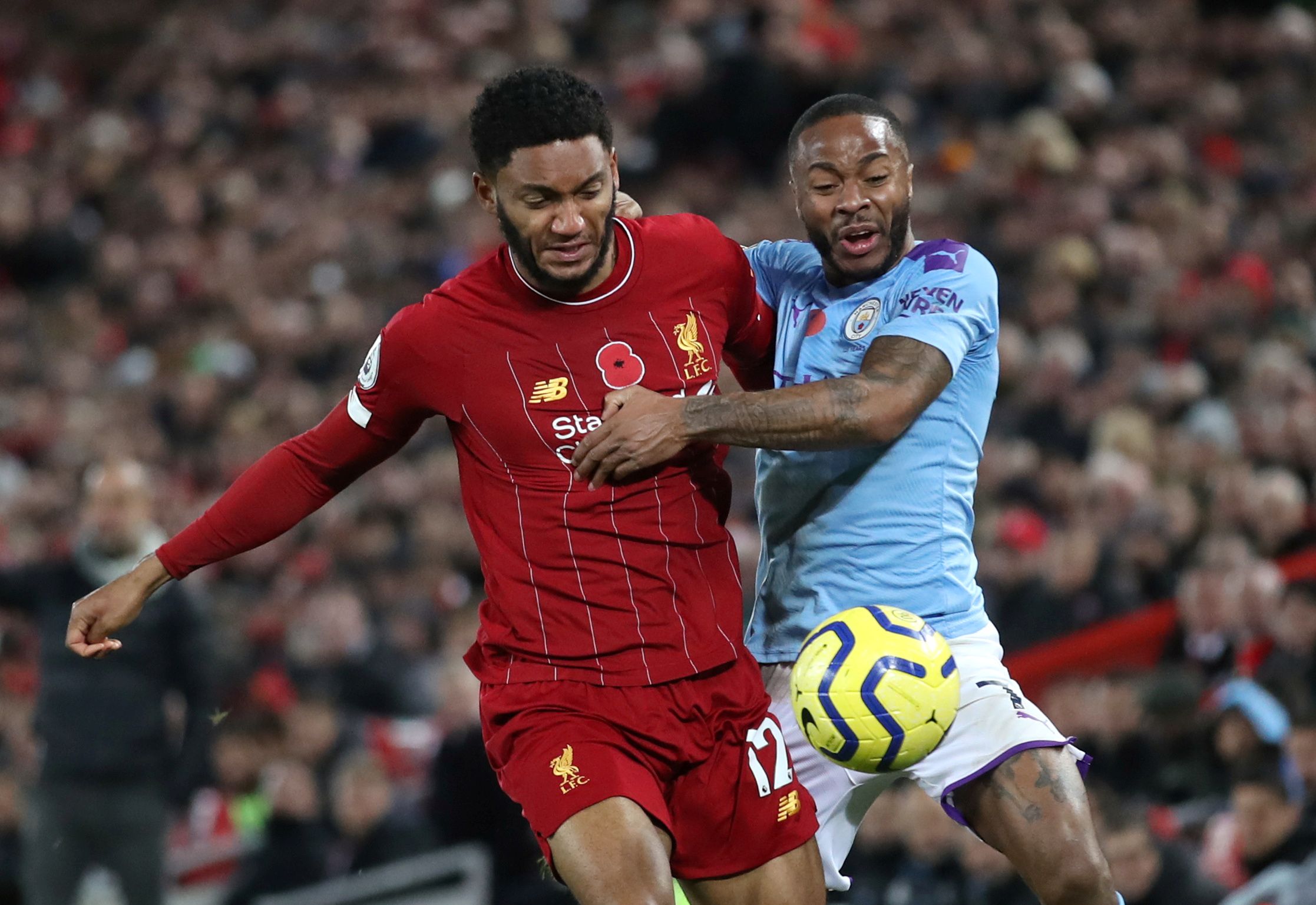 Soccer Football - Premier League - Liverpool v Manchester City - Anfield, Liverpool, Britain - November 10, 2019. Picture taken on November 10, 2019   Liverpool's Joe Gomez in action with Manchester City's Raheem Sterling  Action Images via Reuters/Carl Recine    EDITORIAL USE ONLY. No use with unauthorized audio, video, data, fixture lists, club/league logos or "live" services. Online in-match use limited to 75 images, no video emulation. No use in betting, games or single club/league/player pu