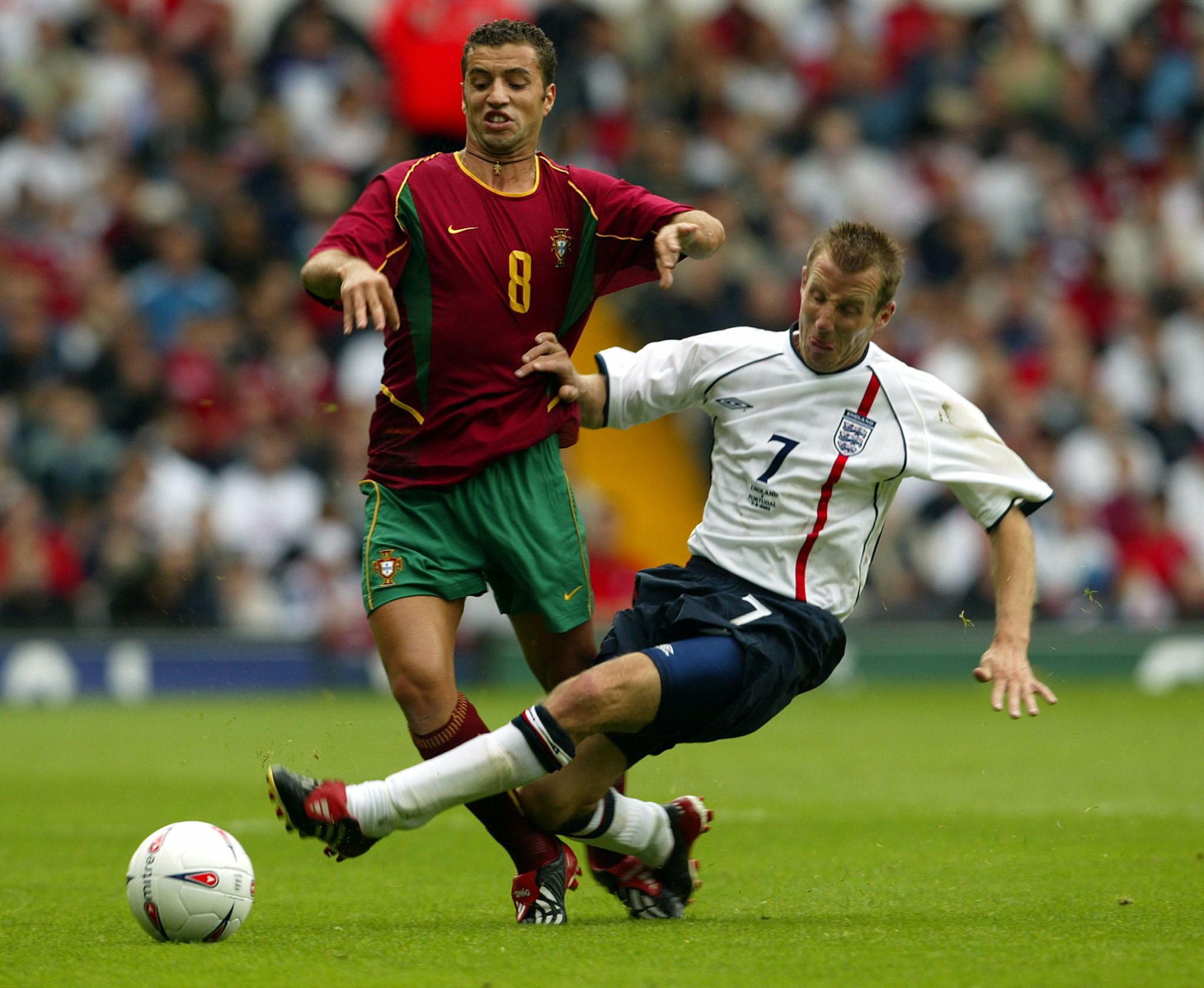 Portugal's Simao Sabrosa (L) is tackled by England's Lee Bowyer in
their friendly international match at the Villa Park in Birmingham
September 7, 2002. England and Portugal drew 1-1. REUTERS/Darren
Staples

DS/NMB/AA