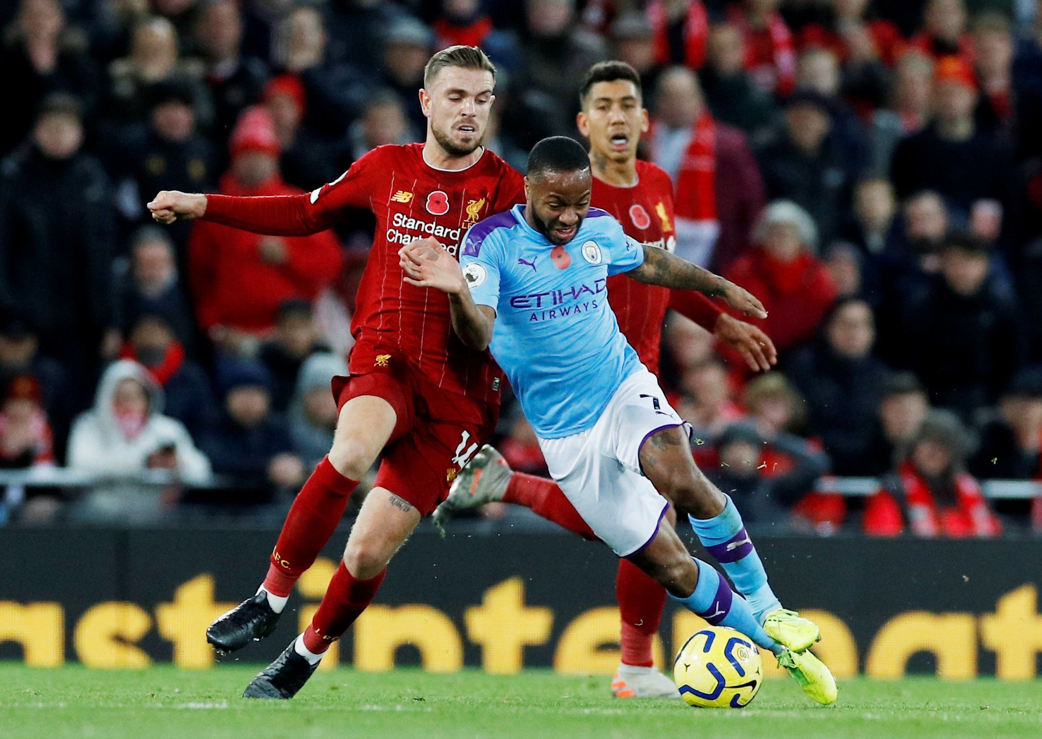 Soccer Football - Premier League - Liverpool v Manchester City - Anfield, Liverpool, Britain - November 10, 2019  Manchester City's Raheem Sterling in action with Liverpool's Jordan Henderson   REUTERS/Phil Noble  EDITORIAL USE ONLY. No use with unauthorized audio, video, data, fixture lists, club/league logos or 