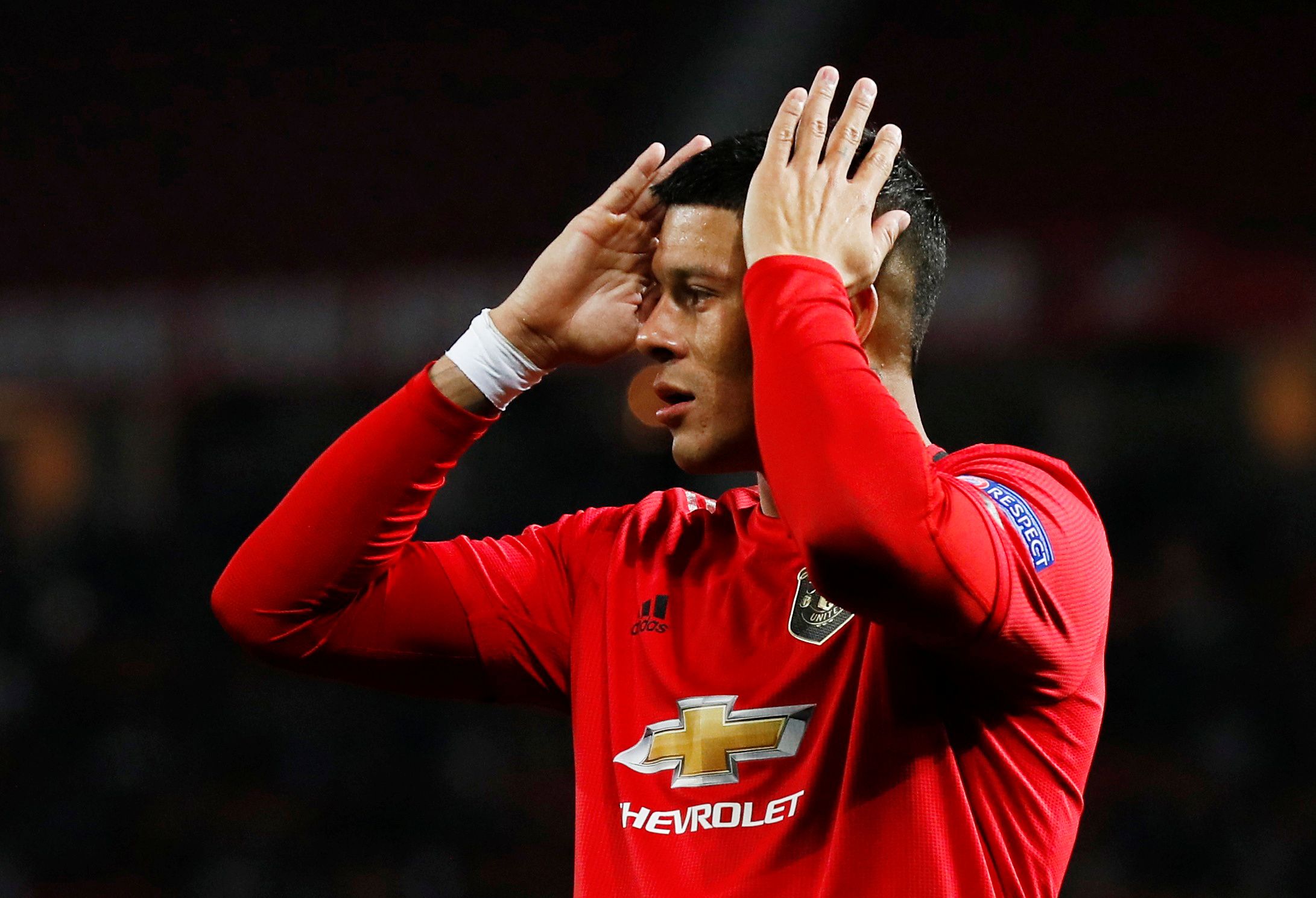 Marcos Rojo with his head in his hands