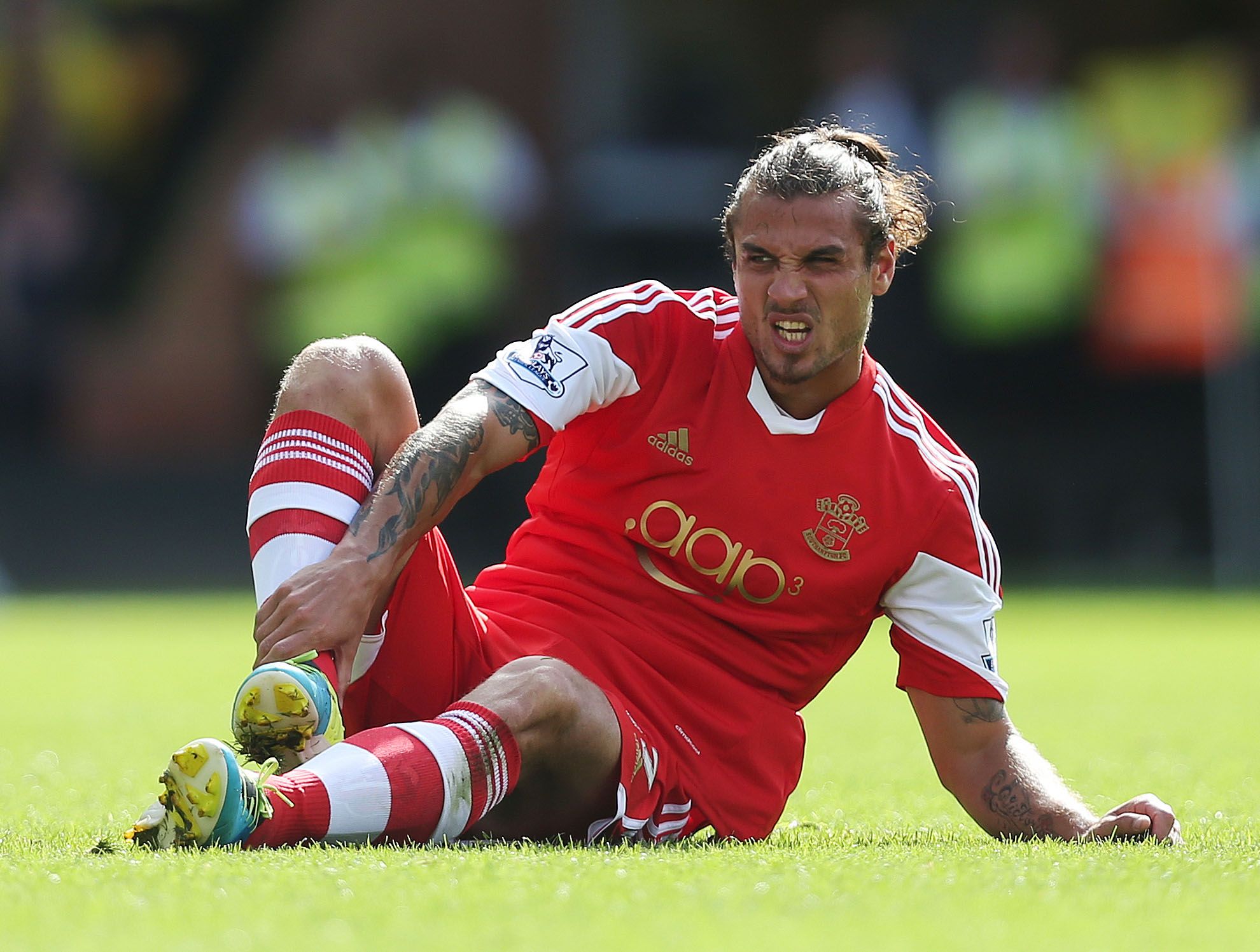 Football - Norwich City v Southampton - Barclays Premier League - Carrow Road - 31/8/13 
Southampton's Daniel Osvaldo sits on the pitch after sustaining an injury 
Mandatory Credit: Action Images / Matthew Childs 
Livepic 
EDITORIAL USE ONLY. No use with unauthorized audio, video, data, fixture lists, club/league logos or live services. Online in-match use limited to 45 images, no video emulation. No use in betting, games or single club/league/player publications.  Please contact your account re