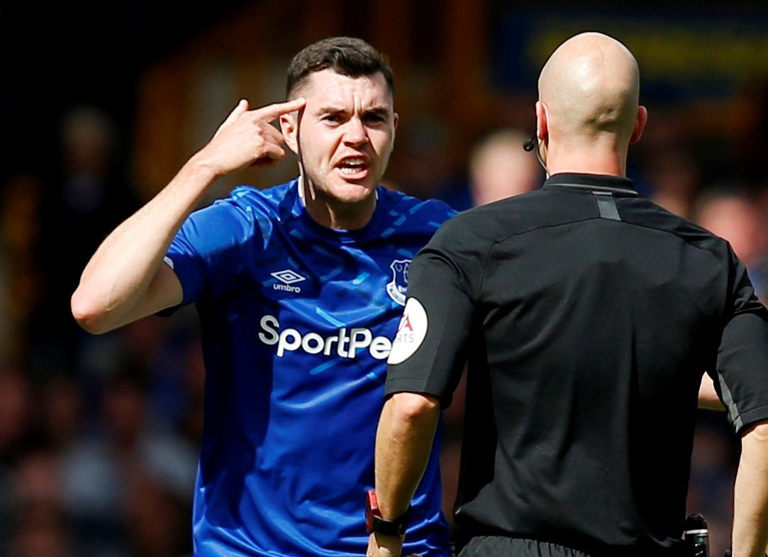 Soccer Football - Premier League - Everton v Wolverhampton Wanderers - Goodison Park, Liverpool, Britain - September 1, 2019  Everton's Michael Keane reacts to referee Anthony Taylor  REUTERS/Andrew Yates  EDITORIAL USE ONLY. No use with unauthorized audio, video, data, fixture lists, club/league logos or 