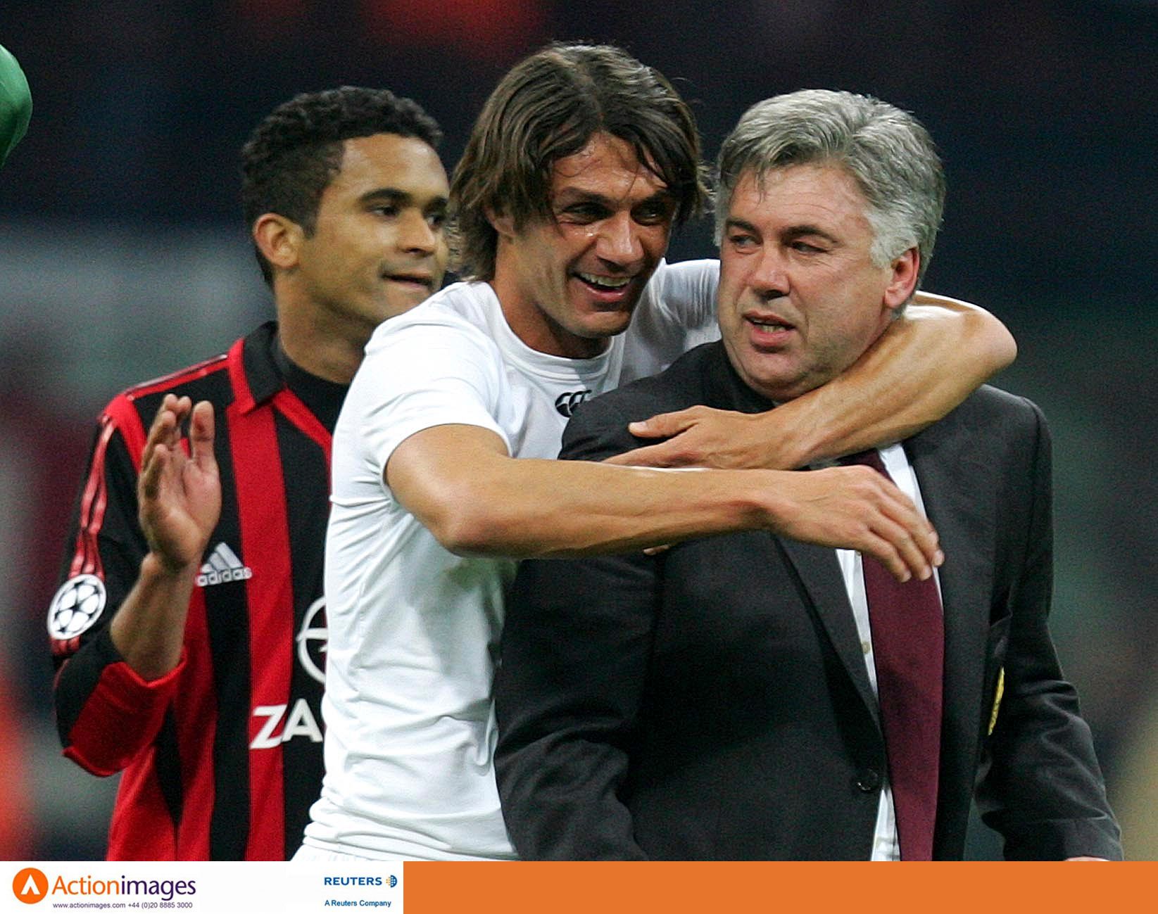 Football - AC Milan v Olympique Lyonnais - UEFA Champions League Quarter Final Second Leg - San Siro Stadium, Milan, Italy - 4/4/06 
AC Milan's Paolo Maldini and manager Carlo Ancelotti at the end of the game 
Mandatory Credit: Action Images / Michael Regan 
Livepic
