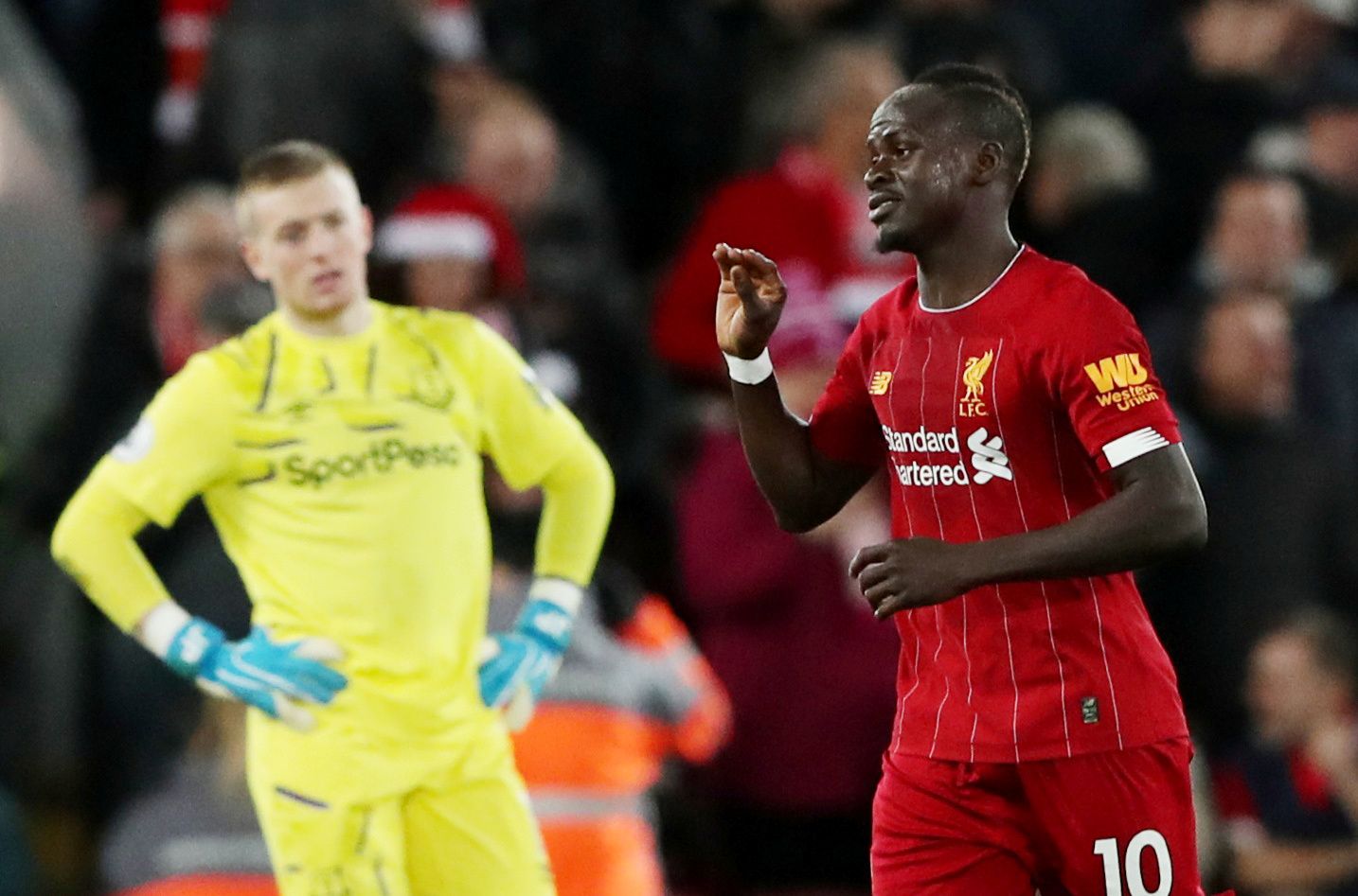 Soccer Football - Premier League - Liverpool v Everton - Anfield, Liverpool, Britain - December 4, 2019  Liverpool's Sadio Mane celebrates scoring their fourth goal as Everton's Jordan Pickford looks dejected   REUTERS/Scott Heppell  EDITORIAL USE ONLY. No use with unauthorized audio, video, data, fixture lists, club/league logos or 