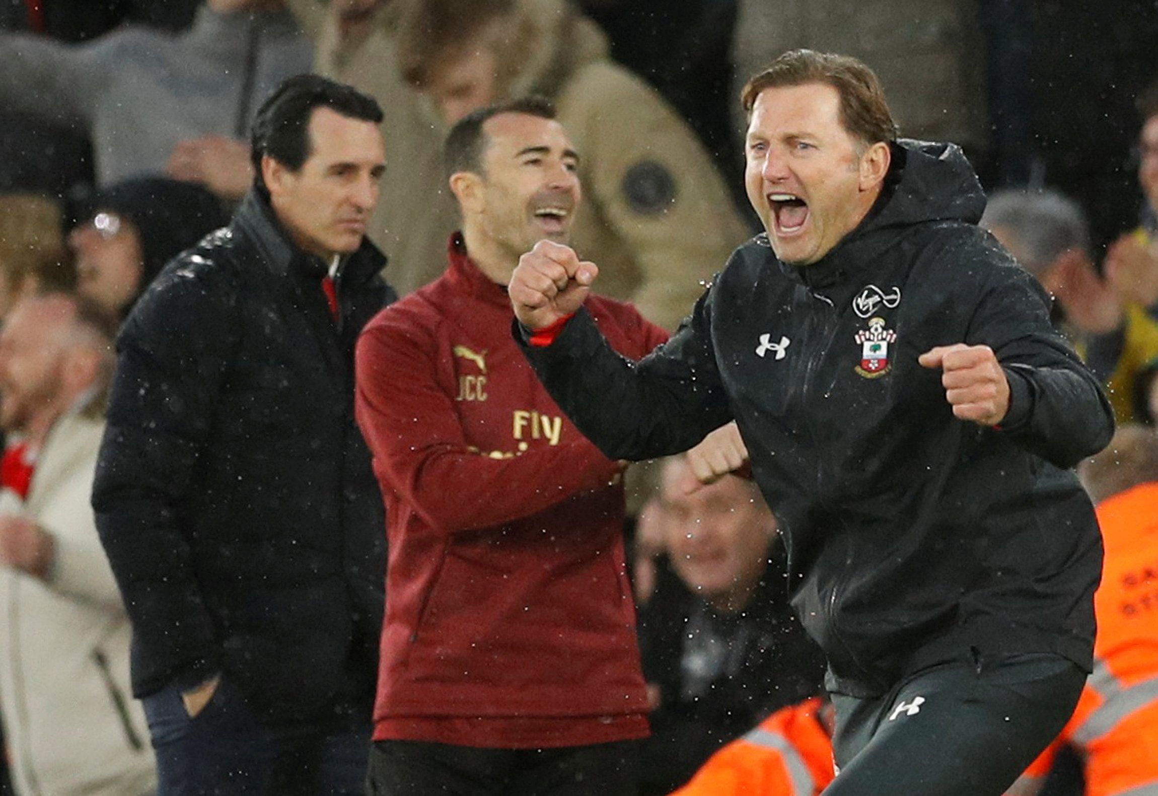 Soccer Football - Premier League - Southampton v Arsenal - St Mary's Stadium, Southampton, Britain - December 16, 2018  Southampton manager Ralph Hasenhuttl celebrates at the end of the match as Arsenal manager Unai Emery looks dejected   Action Images via Reuters/John Sibley  EDITORIAL USE ONLY. No use with unauthorized audio, video, data, fixture lists, club/league logos or "live" services. Online in-match use limited to 75 images, no video emulation. No use in betting, games or single club/le