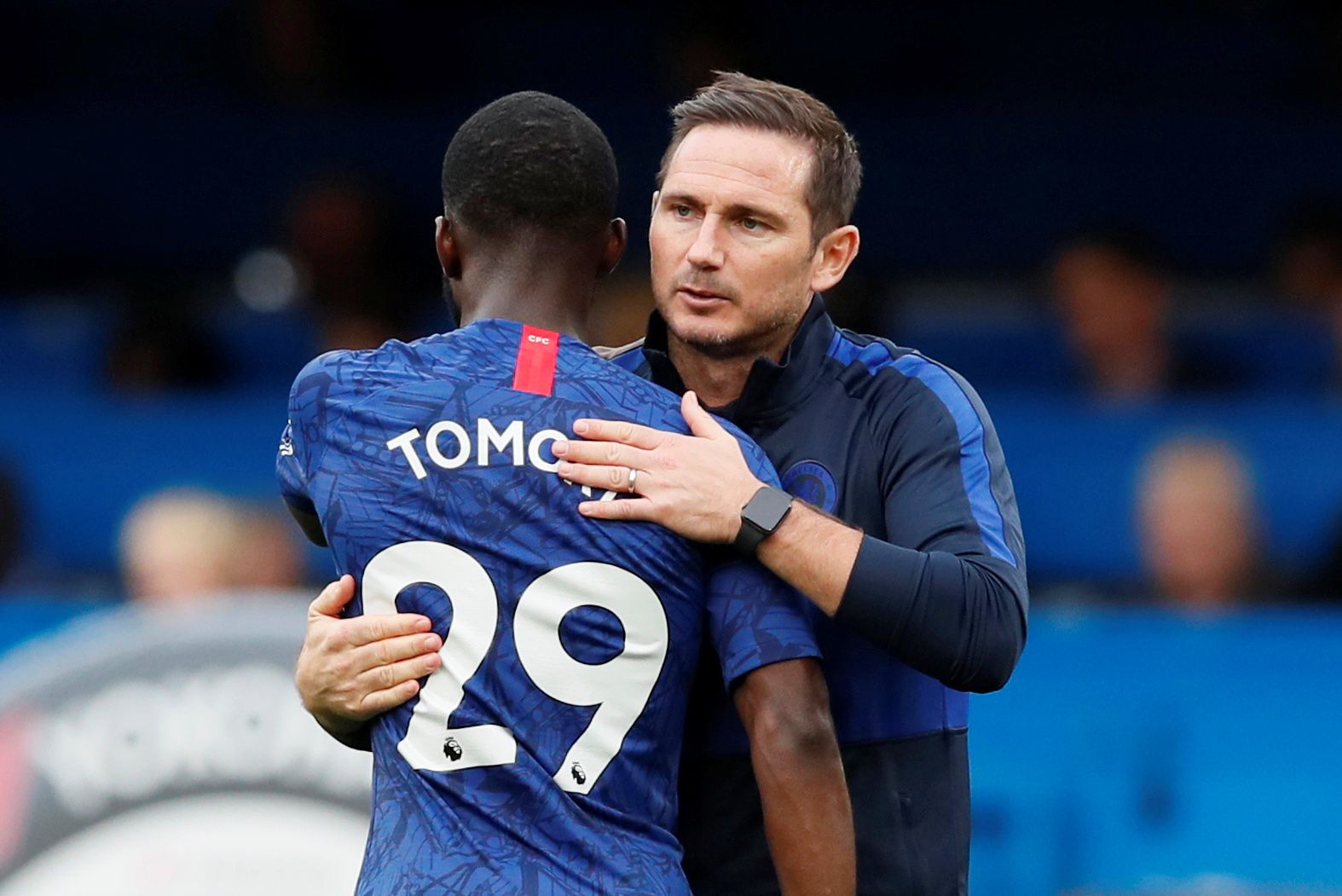 Soccer Football - Premier League - Chelsea v Brighton &amp; Hove Albion - Stamford Bridge, London, Britain - September 28, 2019  Chelsea's Fikayo Tomori celebrates with manager Frank Lampard after the match  REUTERS/David Klein  EDITORIAL USE ONLY. No use with unauthorized audio, video, data, fixture lists, club/league logos or 