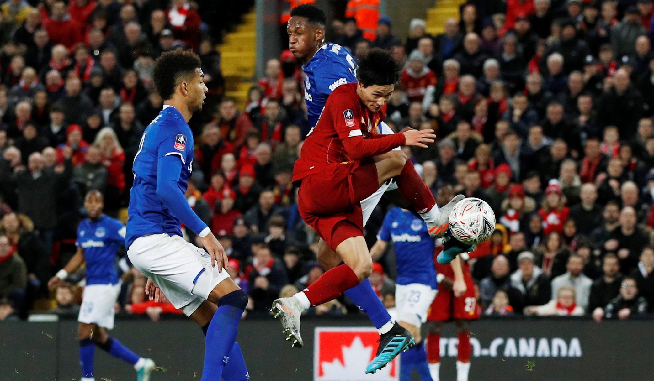 Soccer Football - FA Cup - Third Round - Liverpool v Everton - Anfield, Liverpool, Britain - January 5, 2020  Liverpool's Takumi Minamino in action with Everton's Yerry Mina and Mason Holgate   REUTERS/Phil Noble