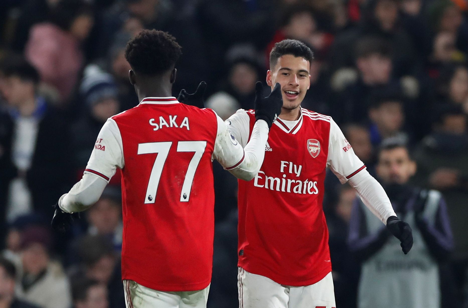 Soccer Football - Premier League - Chelsea v Arsenal - Stamford Bridge, London, Britain - January 21, 2020  Arsenal's Gabriel Martinelli celebrates scoring their first goal with Bukayo Saka   Action Images via Reuters/Paul Childs  EDITORIAL USE ONLY. No use with unauthorized audio, video, data, fixture lists, club/league logos or 