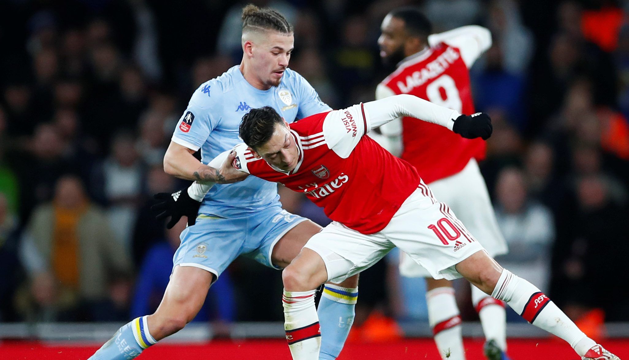 Soccer Football - FA Cup - Third Round - Arsenal v Leeds United - Emirates Stadium, London, Britain - January 6, 2020   Arsenal's Mesut Ozil in action with Leeds United's Kalvin Phillips   REUTERS/Eddie Keogh