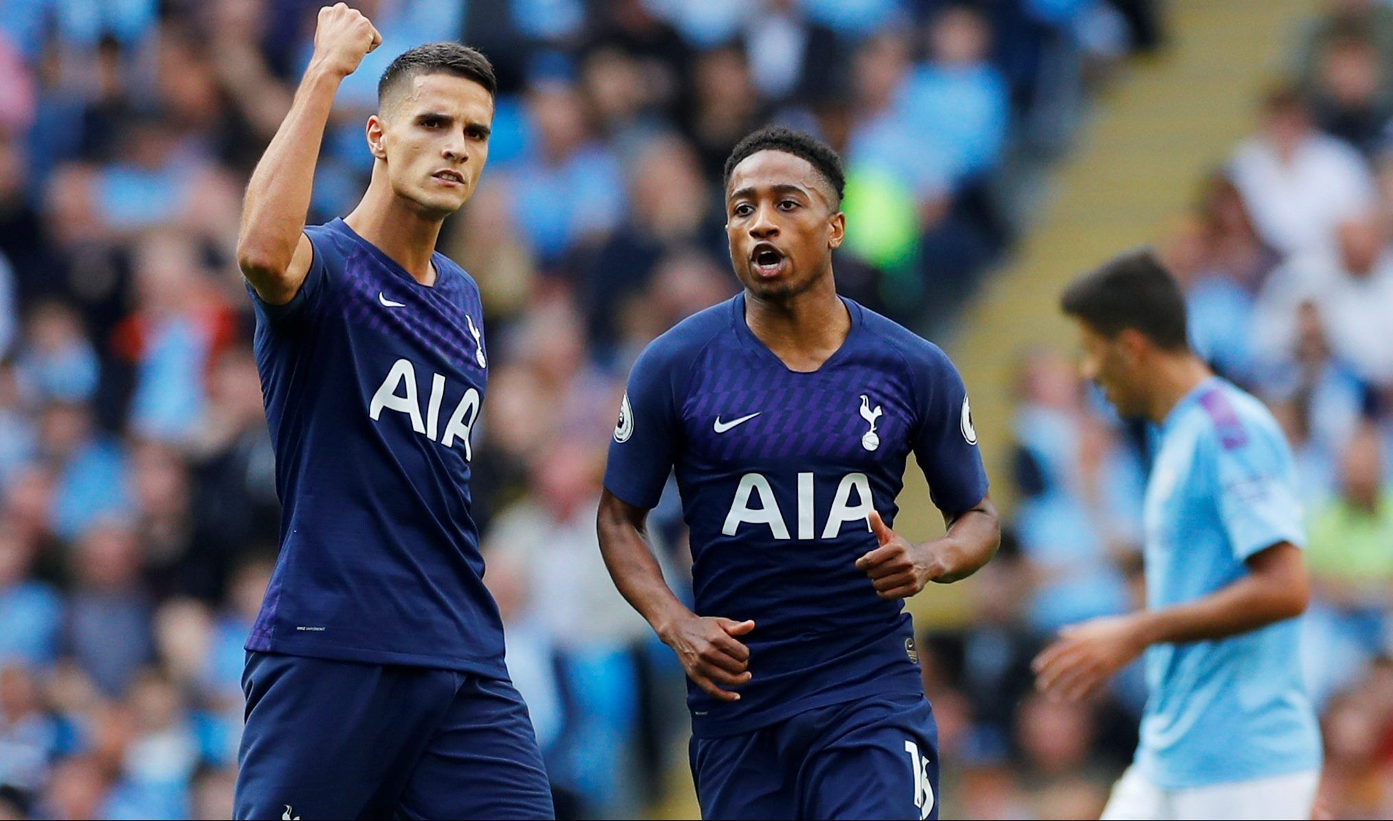 Soccer Football - Premier League - Manchester City v Tottenham Hotspur - Etihad Stadium, Manchester, Britain - August 17, 2019  Tottenham Hotspur's Erik Lamela celebrates scoring their first goal with Kyle Walker-Peters   REUTERS/Phil Noble  EDITORIAL USE ONLY. No use with unauthorized audio, video, data, fixture lists, club/league logos or 