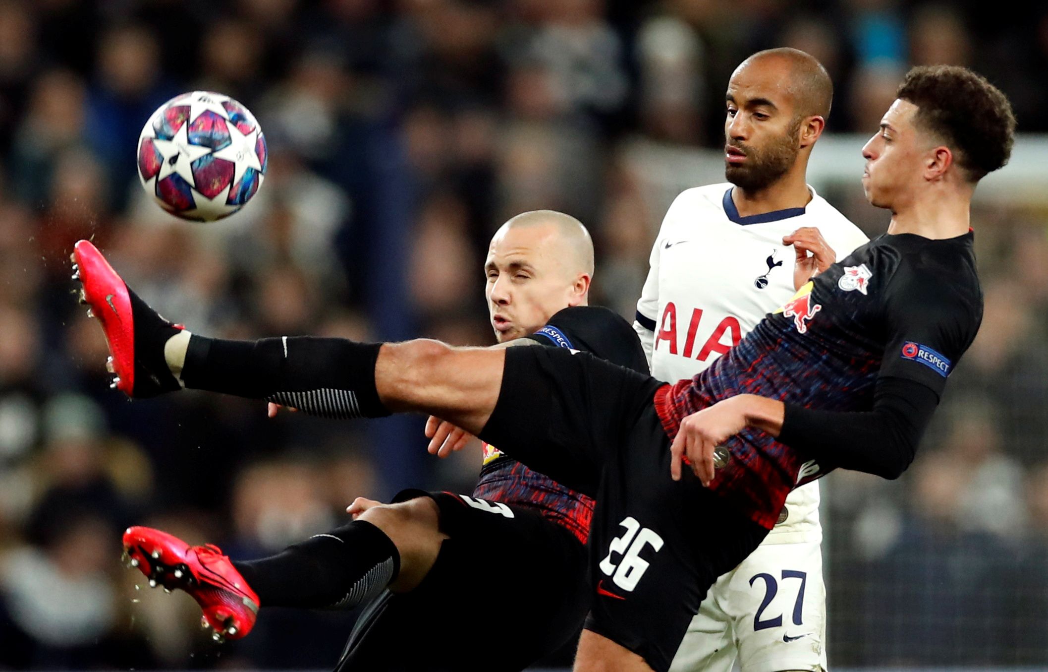 Soccer Football - Champions League - Round of 16 First Leg - Tottenham Hotspur v RB Leipzig - Tottenham Hotspur Stadium, London, Britain - February 19, 2020  RB Leipzig's Angelino and Ethan Ampadu in action with Tottenham Hotspur's Lucas Moura   Action Images via Reuters/Andrew Boyers