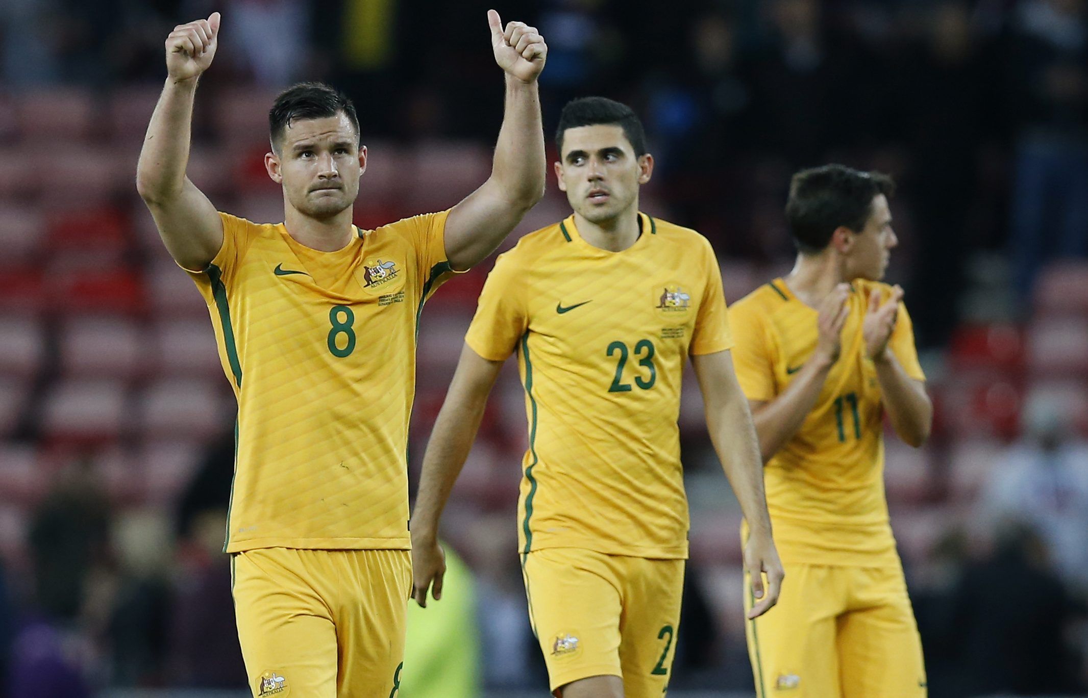 Britain Football Soccer - England v Australia - International Friendly - Stadium of Light, Sunderland - 27/5/16 
(L - R) Australia's Bailey Wright, Tomas Rogic and Christopher Oikonomidis applaud fans at the end of the match 
Reuters / Andrew Yates 
Livepic 
EDITORIAL USE ONLY.